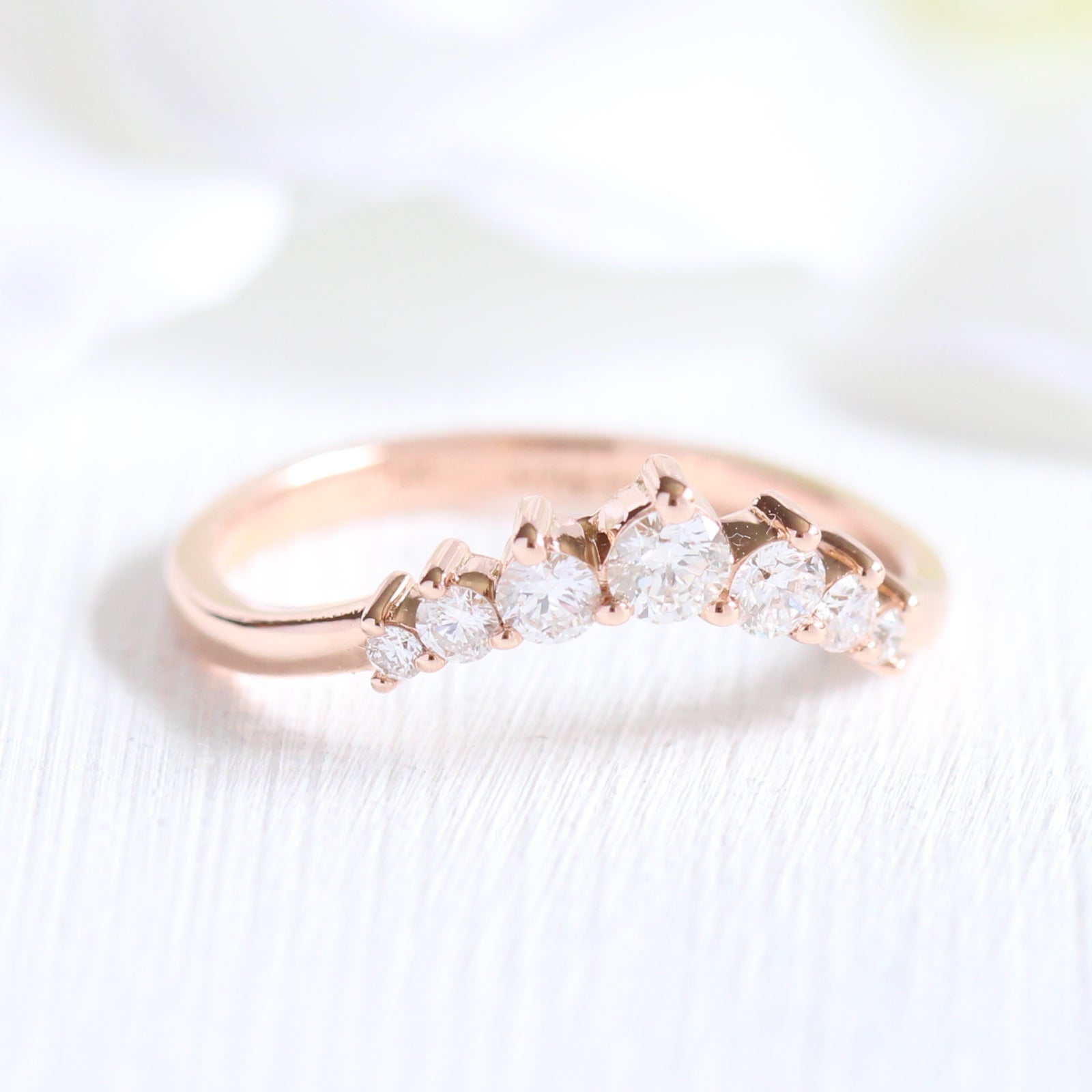 7 stone diamond wedding ring in rose gold curved band by la more design jewelry