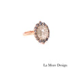 Breathtakingly stunning salt and pepper diamond engagement ring is crafted in a 14k rose gold tiara halo diamond ring setting featuring a large 2.42-carat oval cut natural light grey diamond center encircled by a halo of grey diamonds to create the truly one of a kind look ~ the total diamond weight of the whole ring is 2.96 ct.tw.  