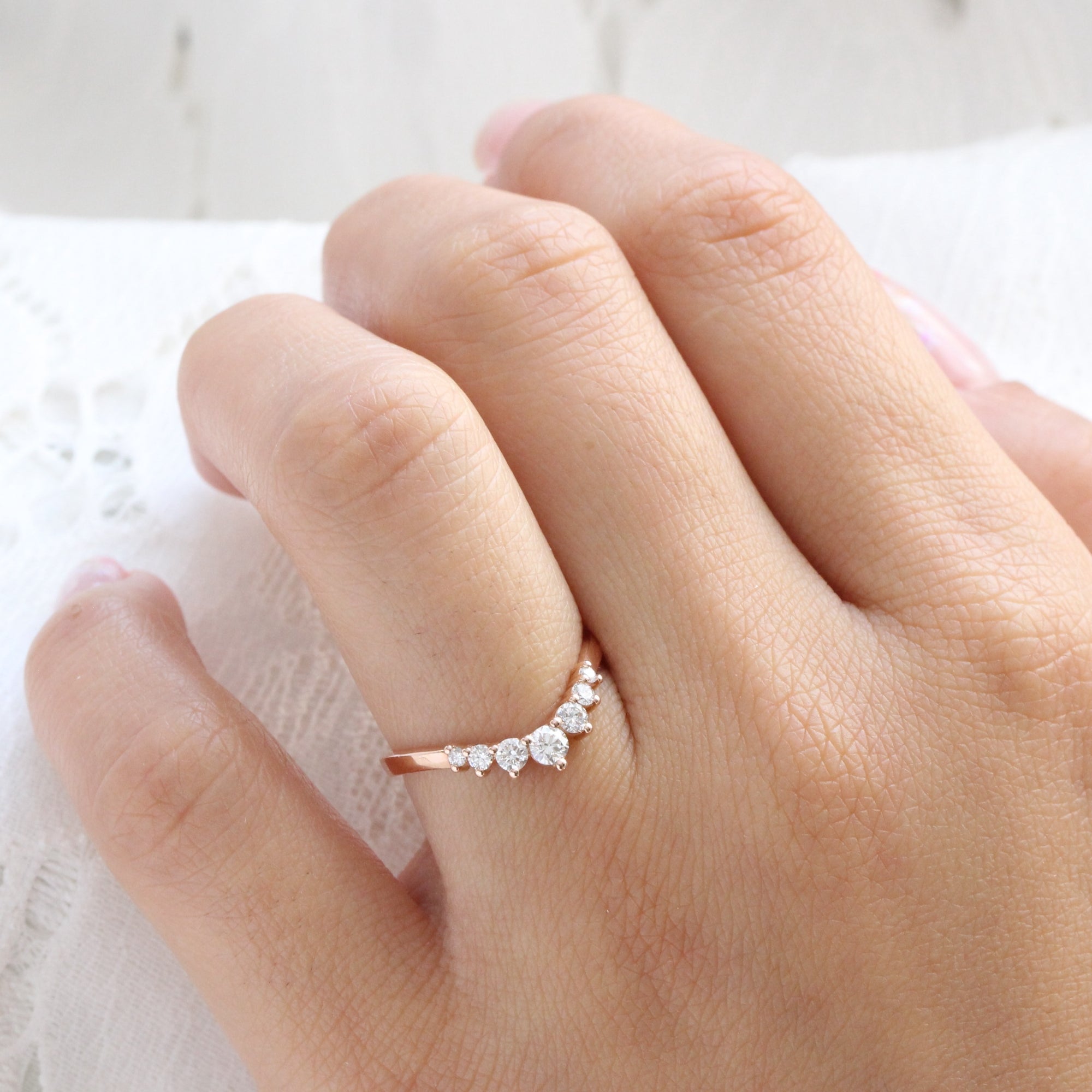 7 stone diamond wedding ring in rose gold curved band by la more design