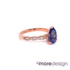 Unique yet timelessly gorgeous sapphire engagement ring is crafted in a 14k rose gold Grace solitaire ring setting with a large 1.98-carat pear cut natural blue sapphire center and is finished in our signature scalloped diamond band ~ the total gemstone and diamond weight of the whole ring is 2.18 ct.tw. This elegant pear solitaire engagement ring will guarantee a big smile on your future bride's face! All our wedding bands can pair beautifully with this pear-cut sapphire diamond ring!