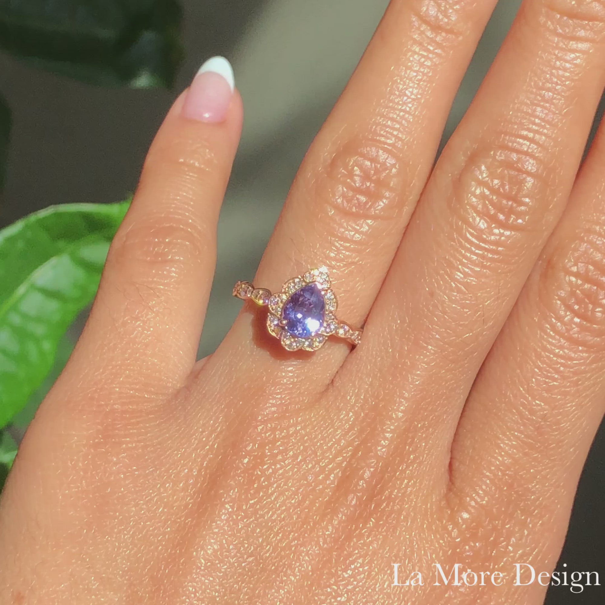 This breathtakingly gorgeous sapphire engagement ring is crafted in 14k rose gold vintage floral diamond ring setting with a 1.25-carat pear cut natural lavender purple sapphire center ~ total gemstone and diamond weight of the whole ring is 1.57 ct.tw.  This unique yet elegant vintage-inspired pear cut engagement ring will guarantee a big smile on your future bride's face! All our wedding bands can pair beautifully with this gorgeous vintage floral diamond sapphire ring!