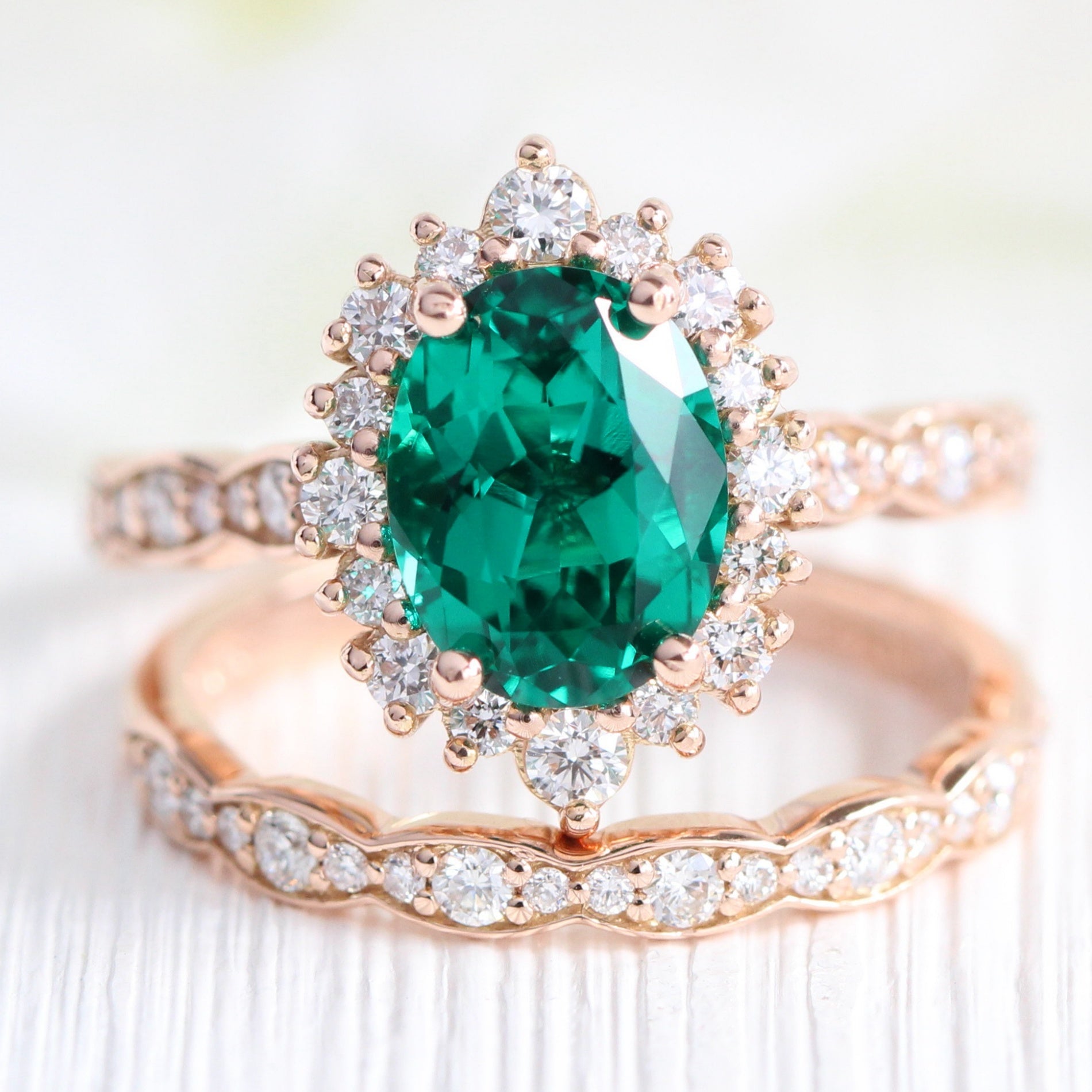 Halo diamond oval emerald ring stock rose gold half eternity wedding band la more design jewelry