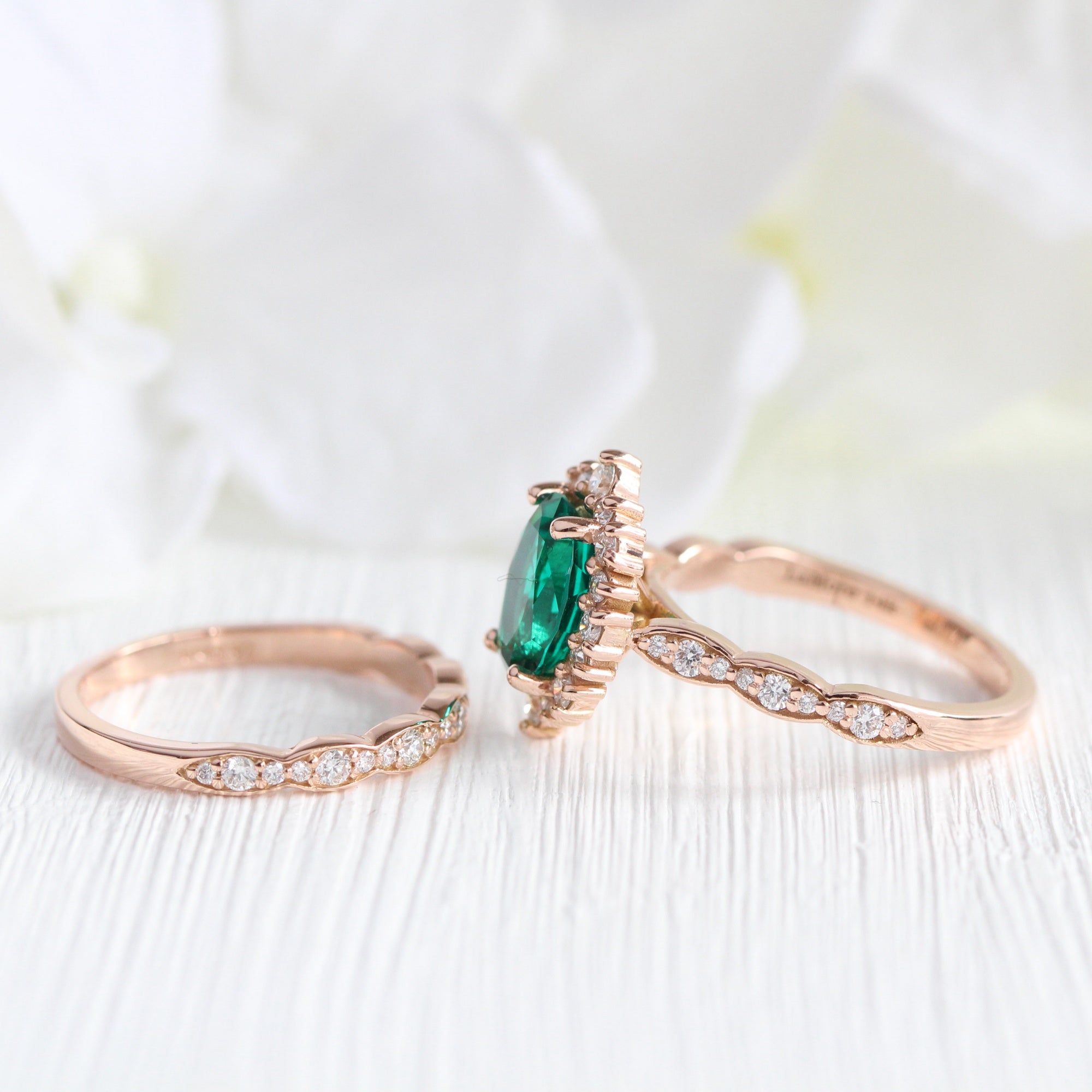 Halo diamond oval emerald ring stock rose gold half eternity wedding band la more design jewelry