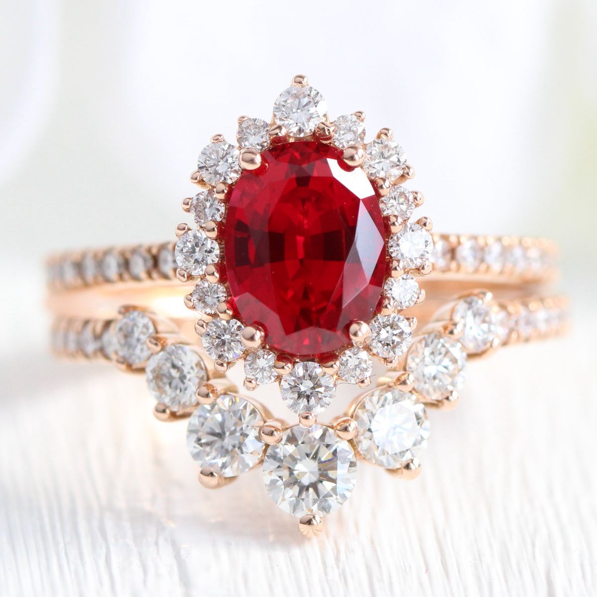 Halo diamond oval ruby ring stack rose gold U curved diamond wedding band la more design jewelry