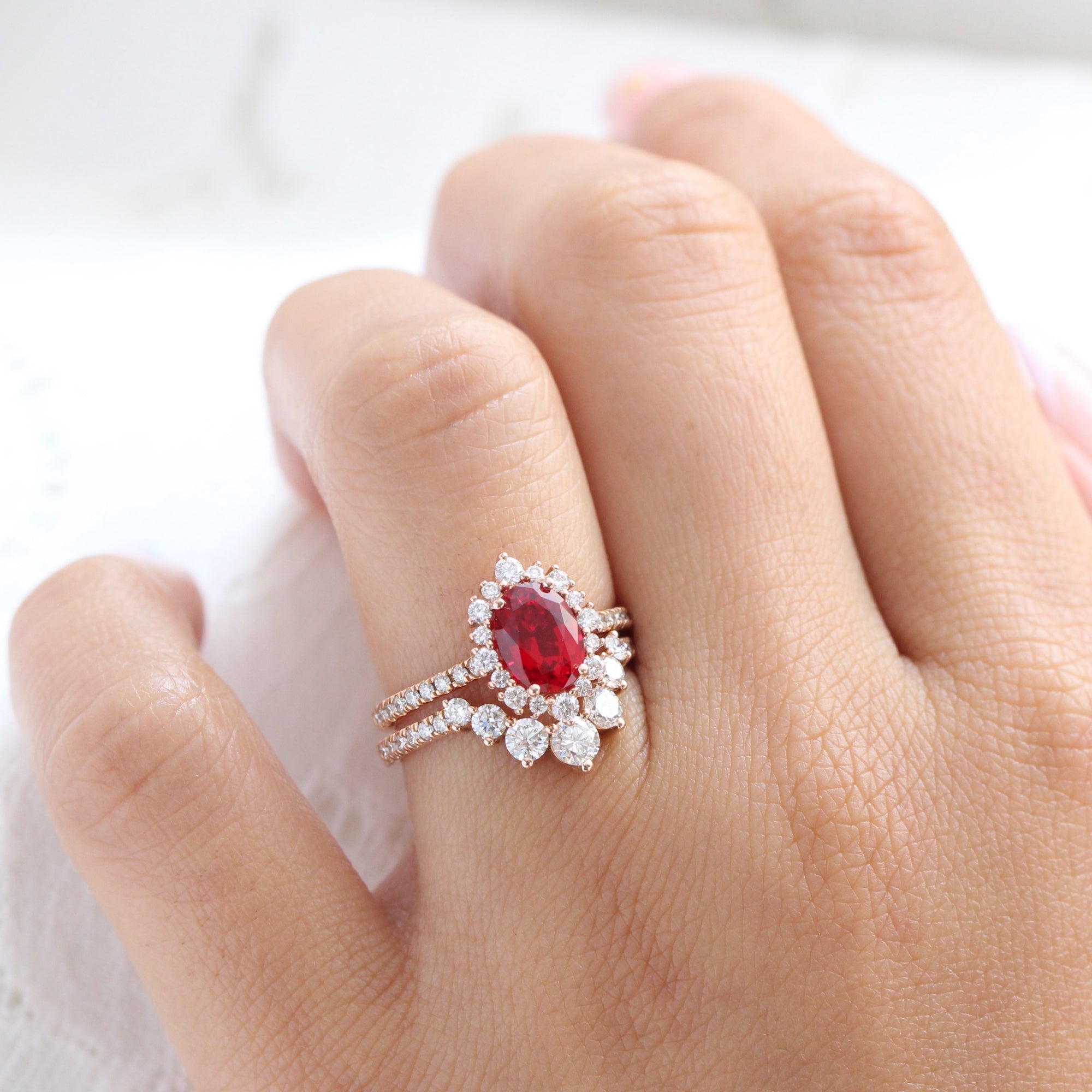 Halo diamond oval ruby ring stack rose gold U curved diamond wedding band la more design jewelry