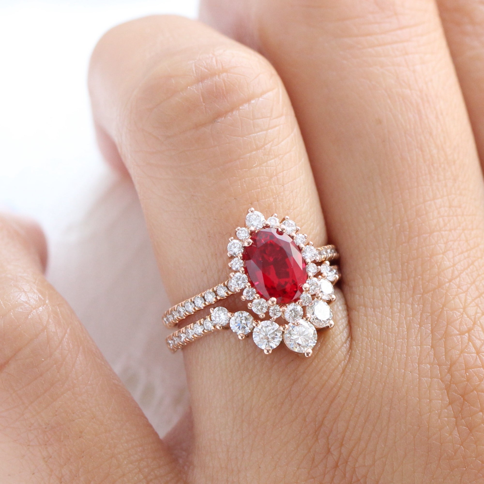 Halo diamond oval ruby ring stack rose gold U curved diamond wedding band la more design jewelry