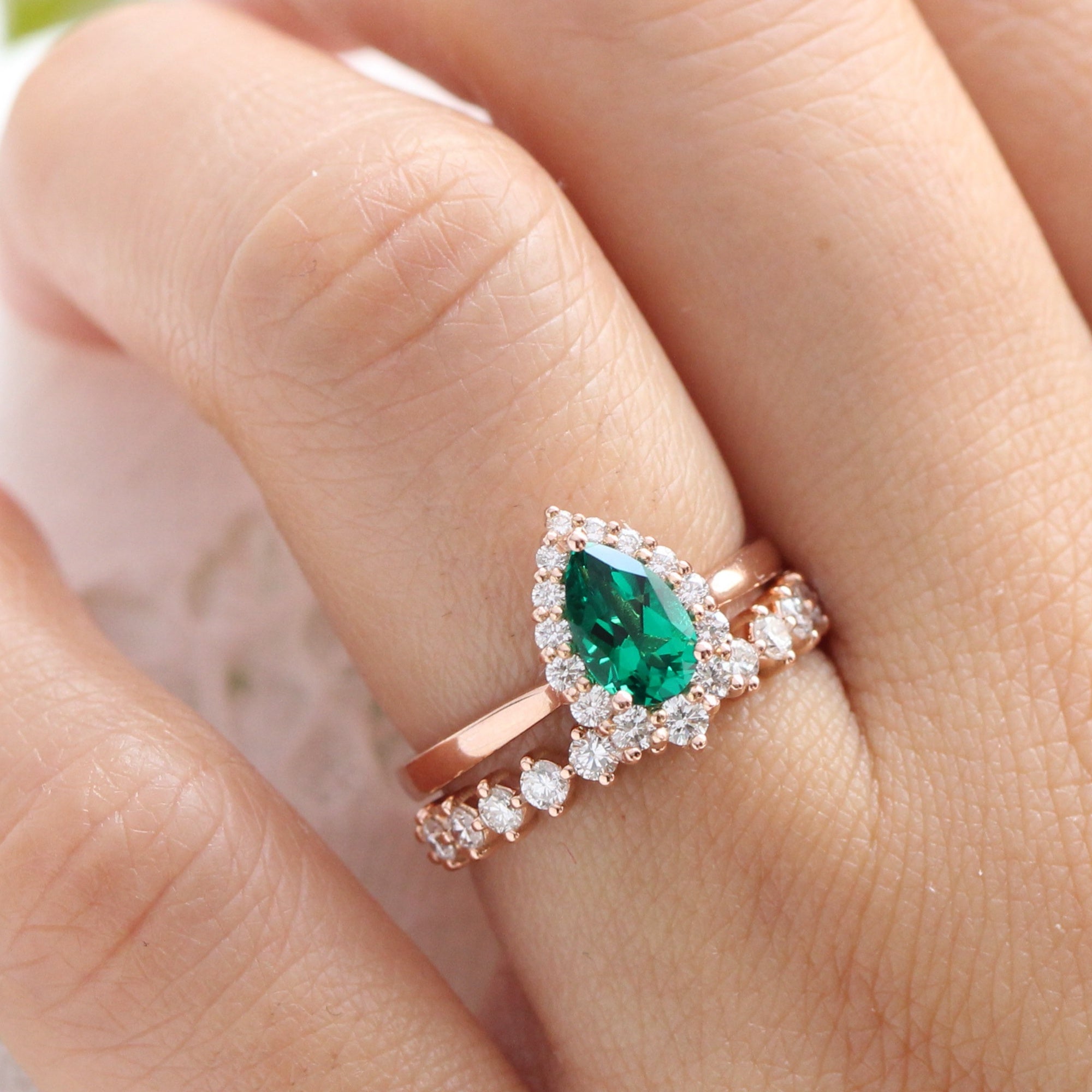 Halo diamond pear emerald ring stock rose gold half eternity wedding band la more design jewelry