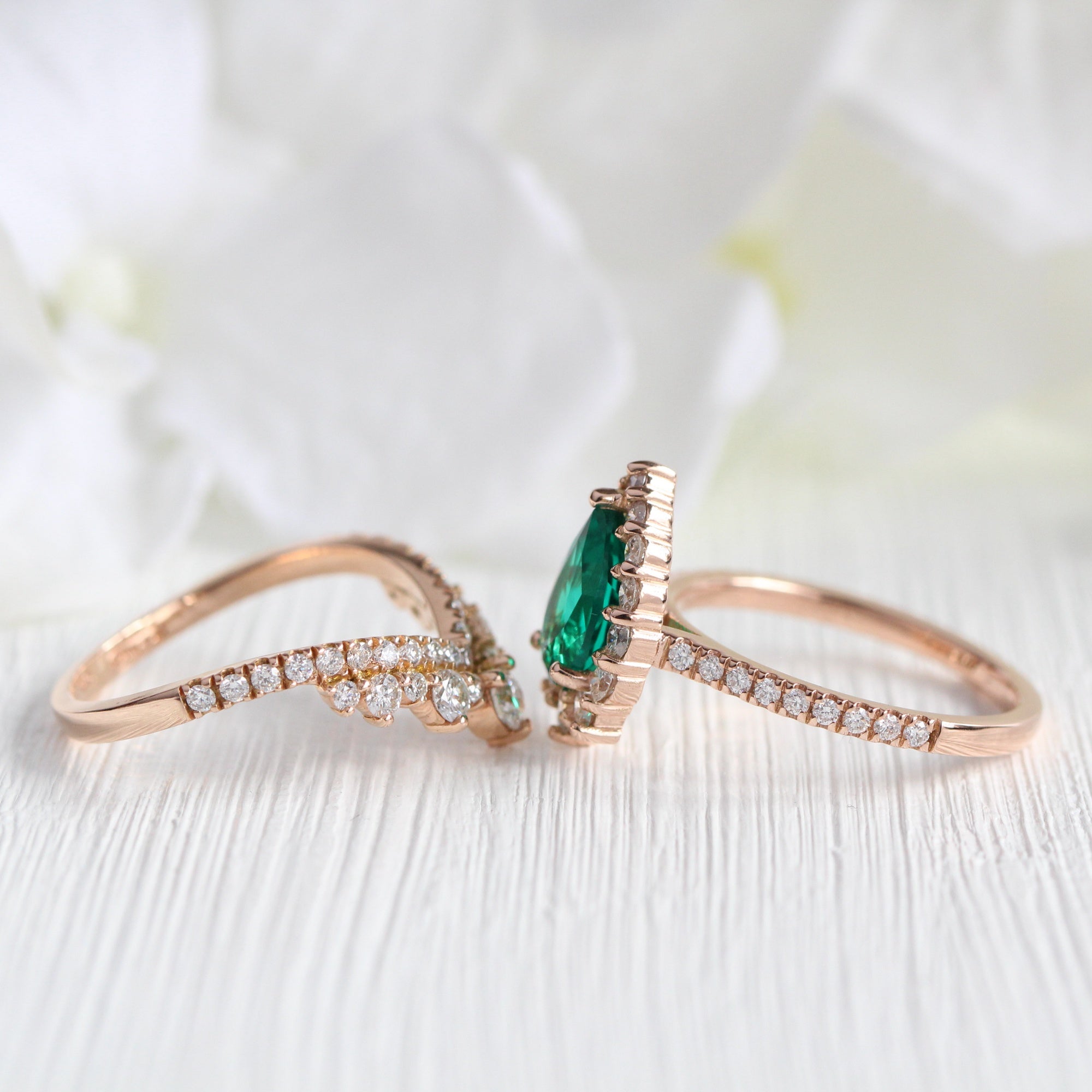 Halo diamond pear emerald ring stock rose gold v shaped wedding band la more design jewelry