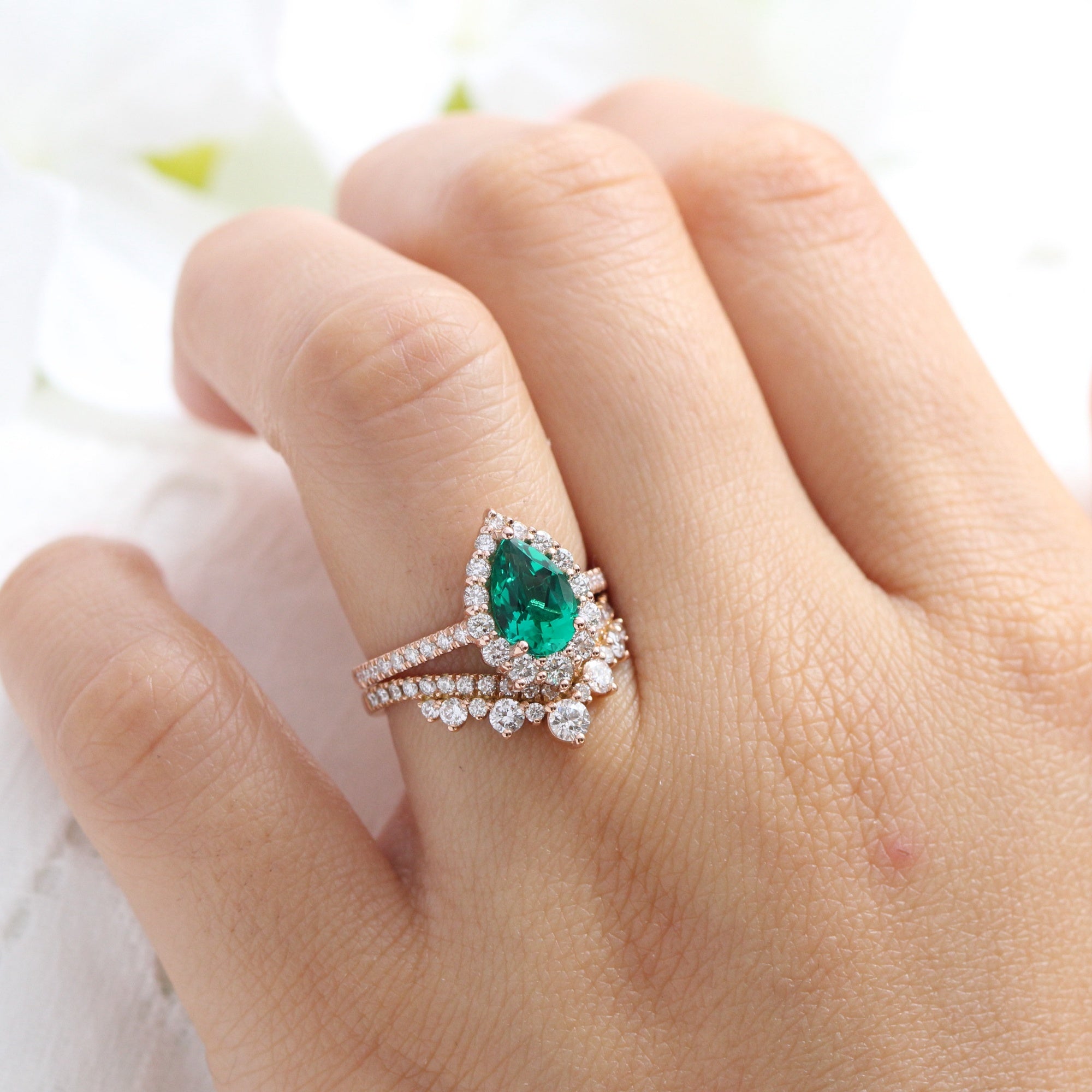 Halo diamond pear emerald ring stock rose gold v shaped wedding band la more design jewelry