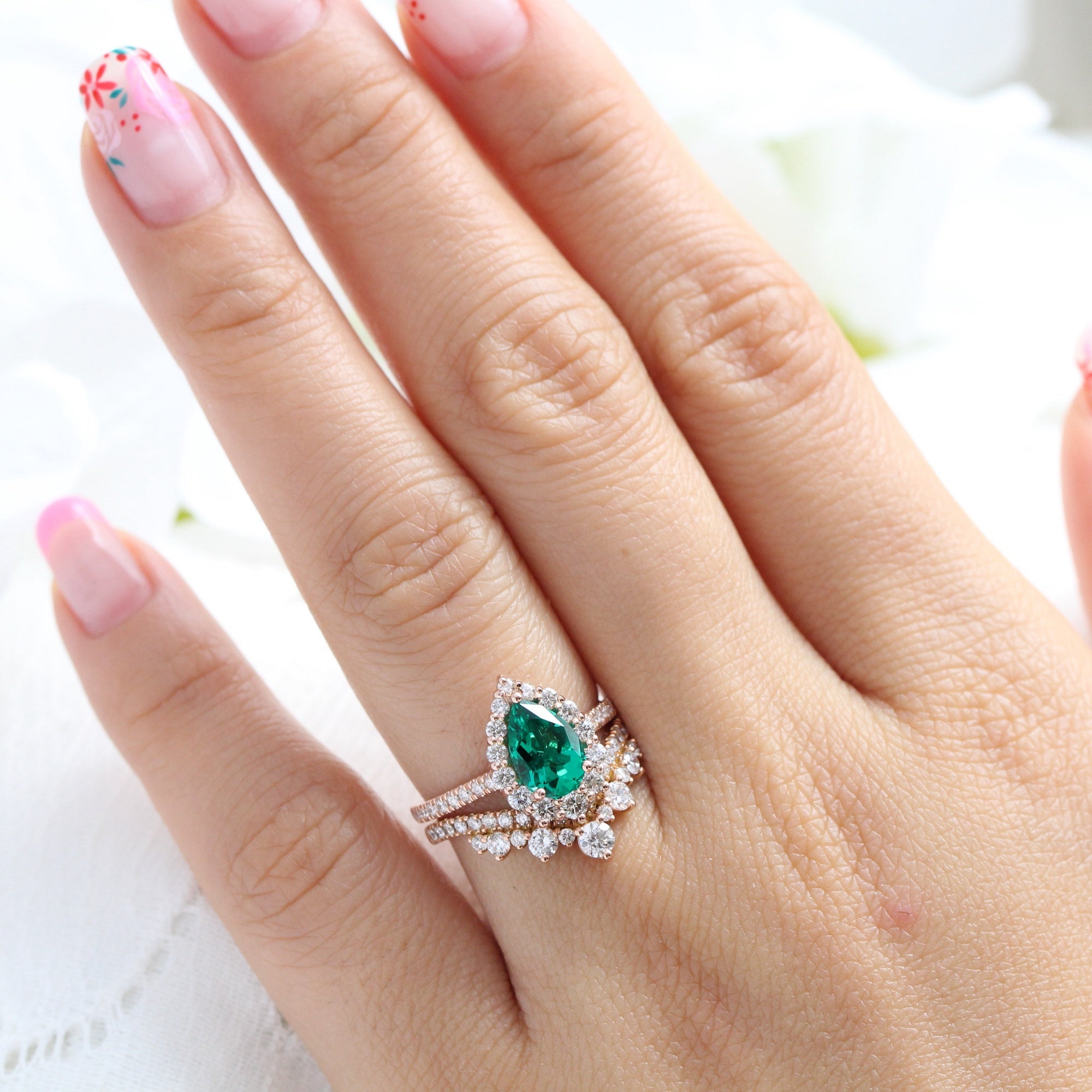 Halo diamond pear emerald ring stock rose gold v shaped wedding band la more design jewelry