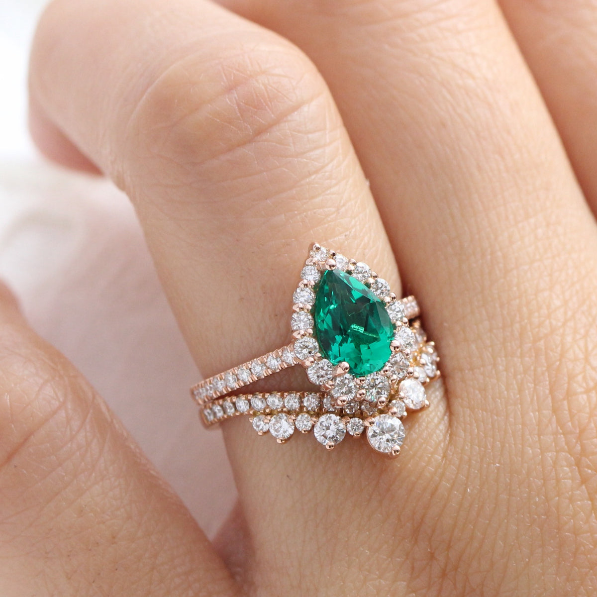 Halo diamond pear emerald ring stock rose gold v shaped wedding band la more design jewelry