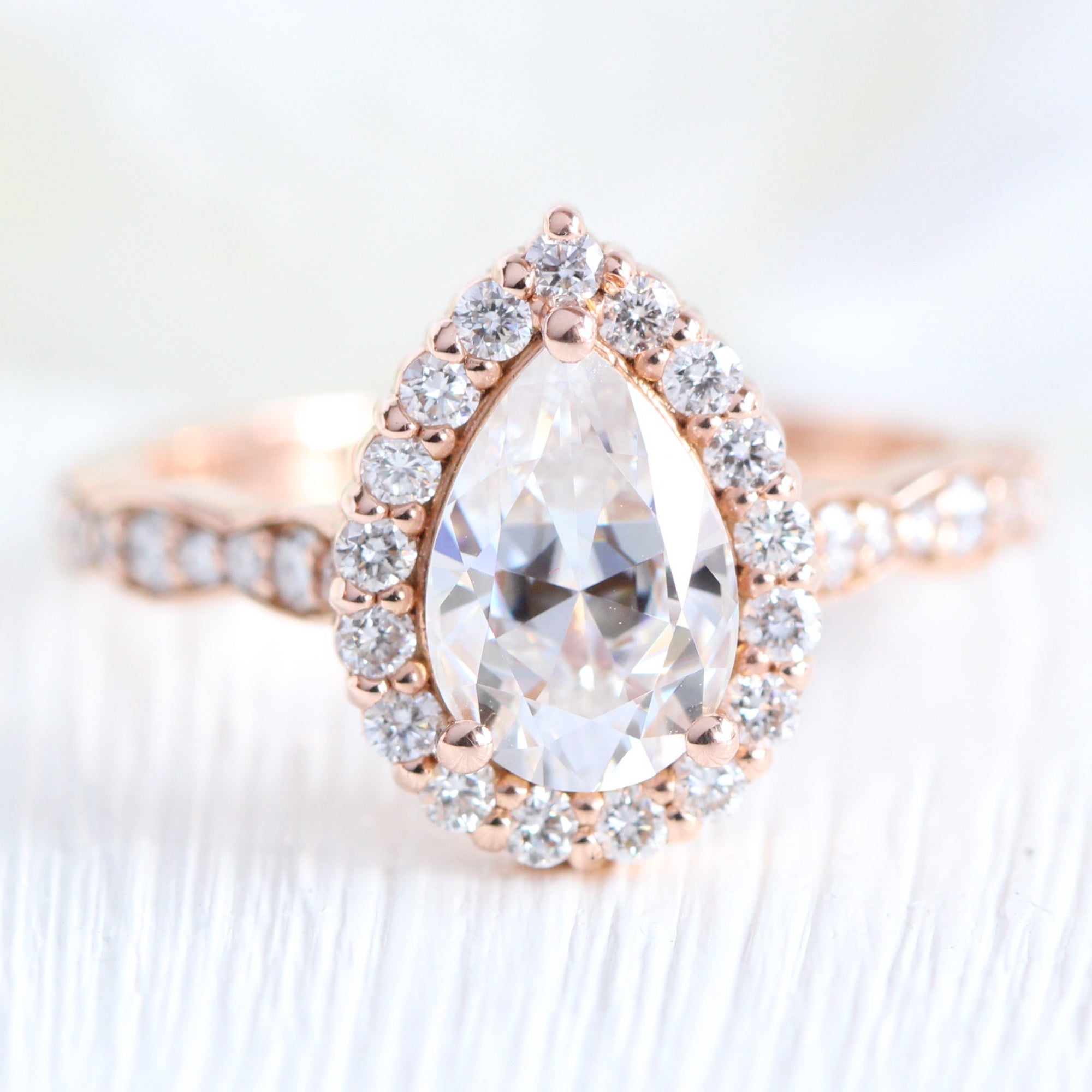 Halo diamond pear moissanite engagement ring in rose gold scalloped band by la more design jewelry