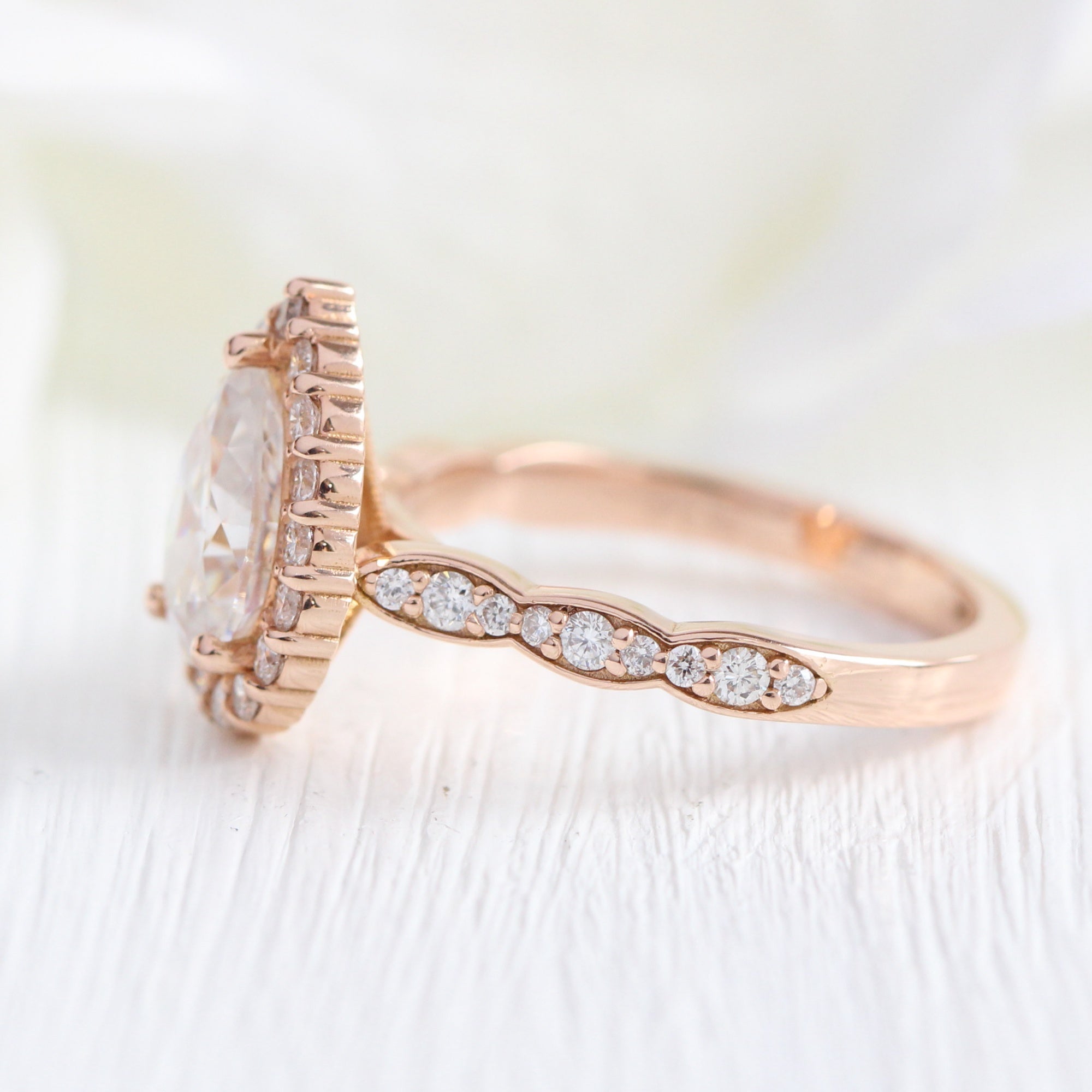 Halo diamond pear moissanite engagement ring in rose gold scalloped band by la more design jewelry
