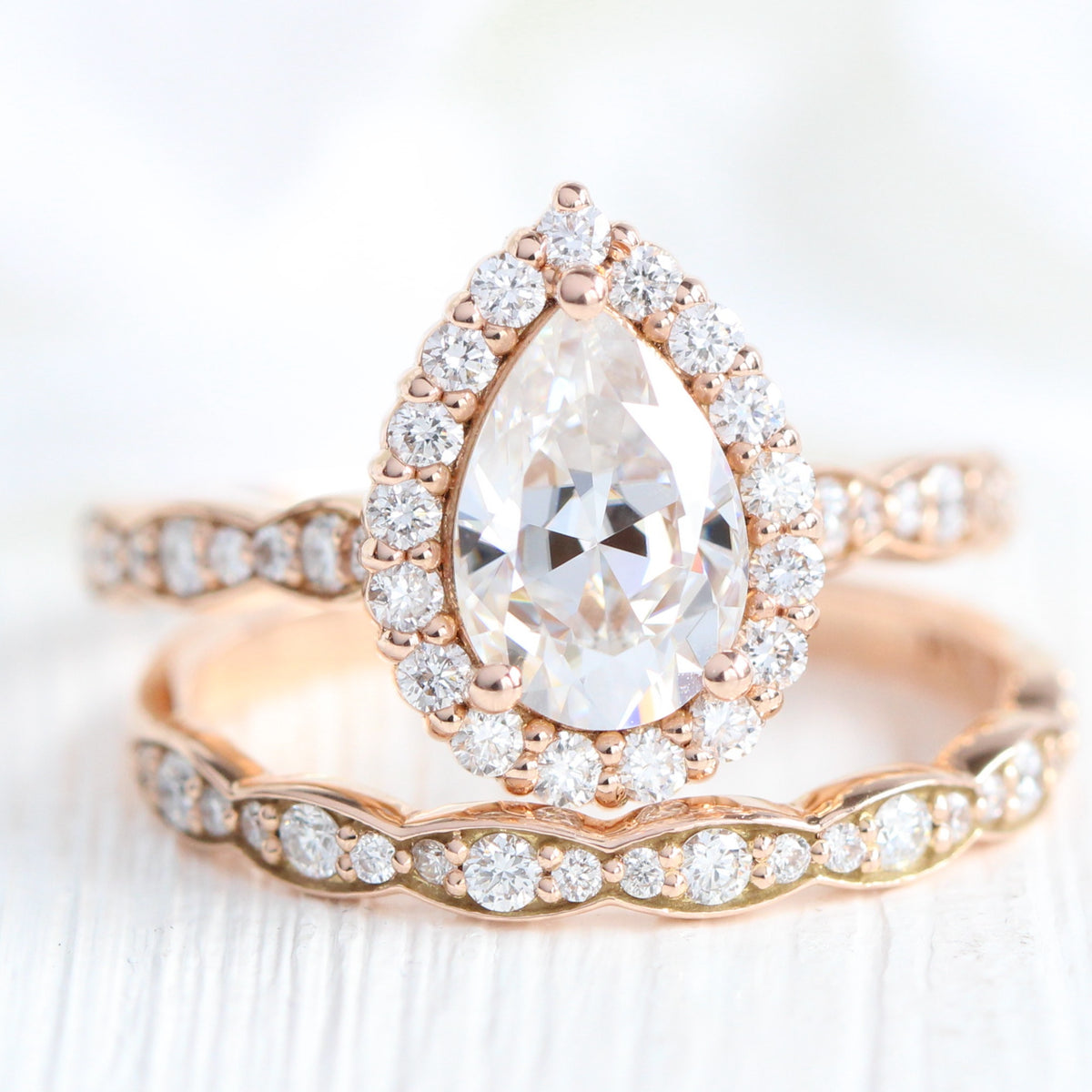 Halo diamond pear moissanite ring bridal set in rose gold scalloped band by la more design jewelry