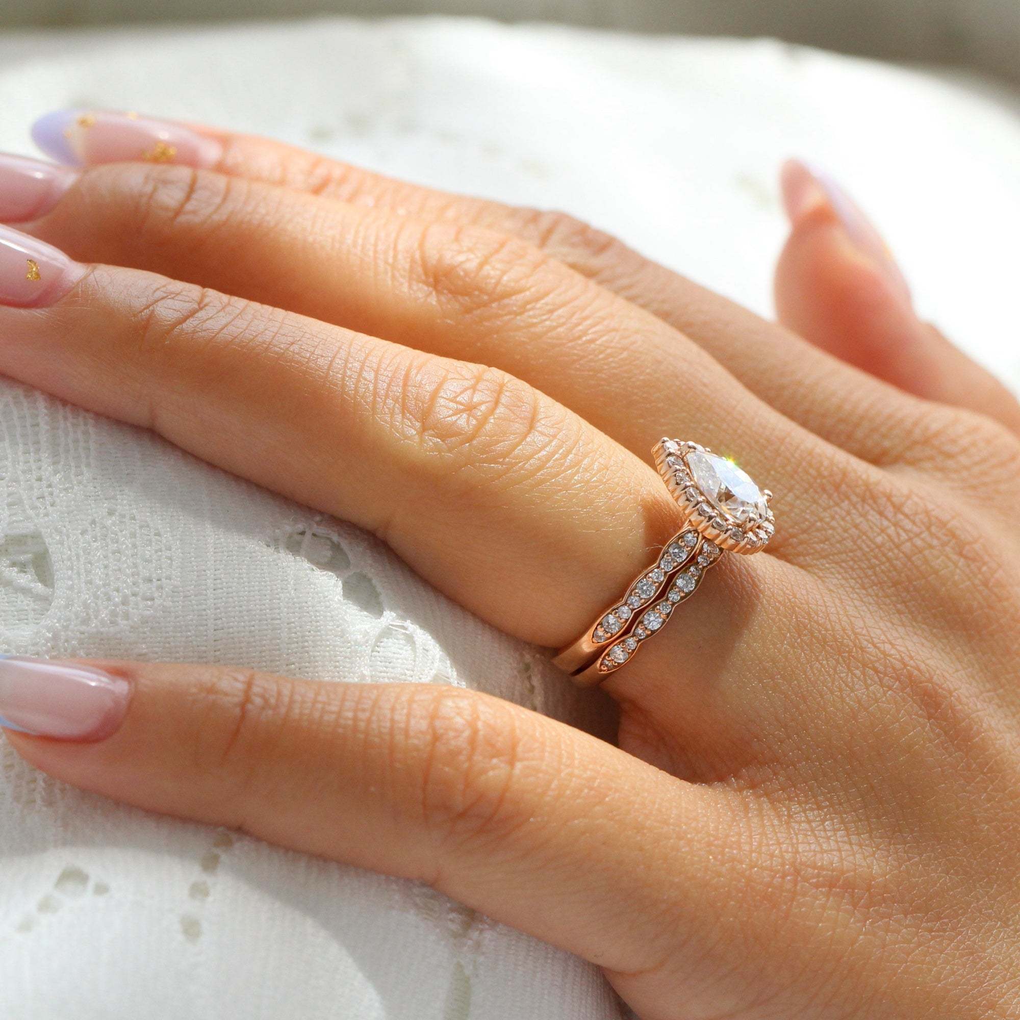 Halo diamond pear moissanite ring bridal set in rose gold scalloped band by la more design jewelry
