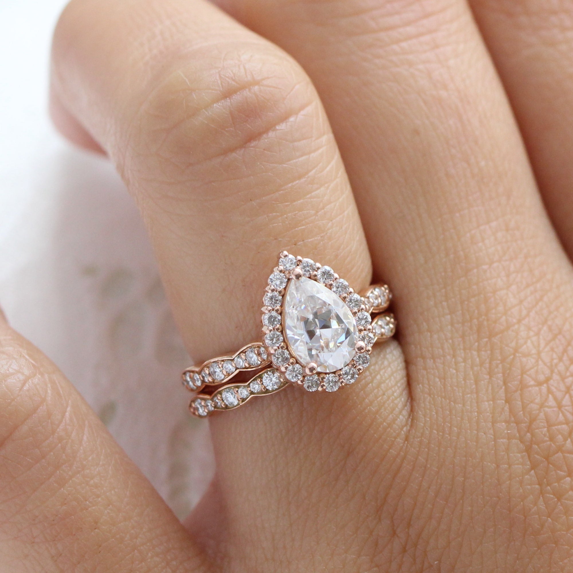 Halo diamond pear moissanite ring bridal set in rose gold scalloped band by la more design jewelry