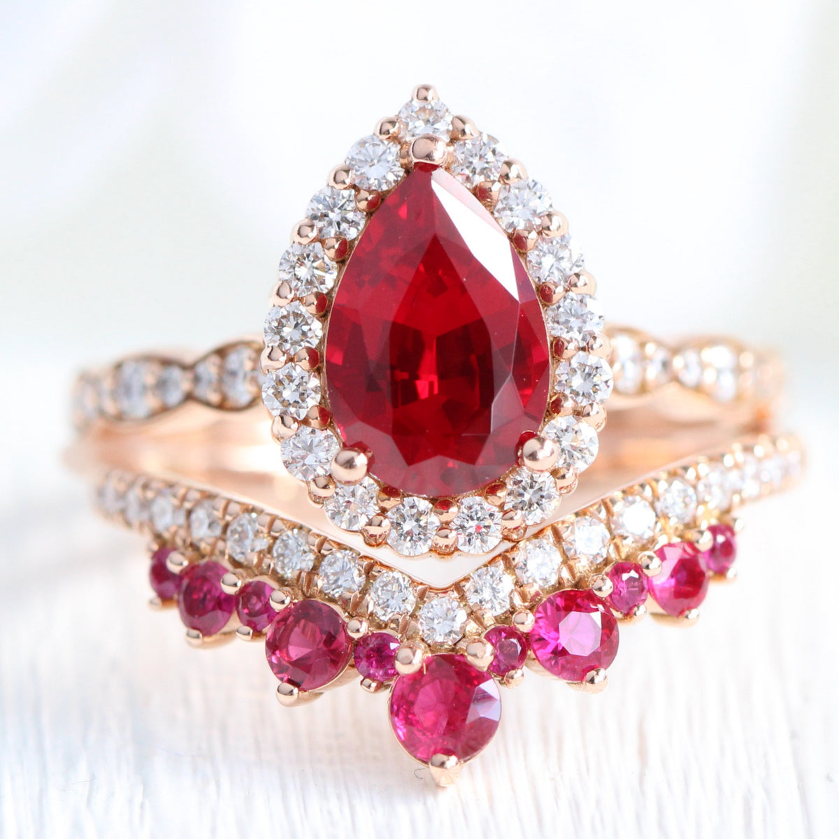 Halo diamond pear ruby ring stack rose gold deep curved wedding band bridal set la more design jewelry