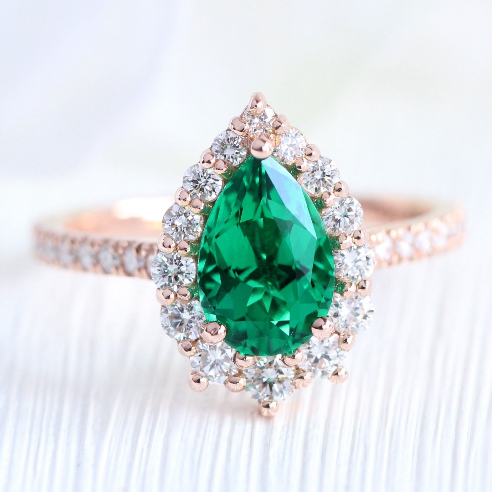 Halo diamond pear emerald ring stock rose gold v shaped wedding band la more design jewelry