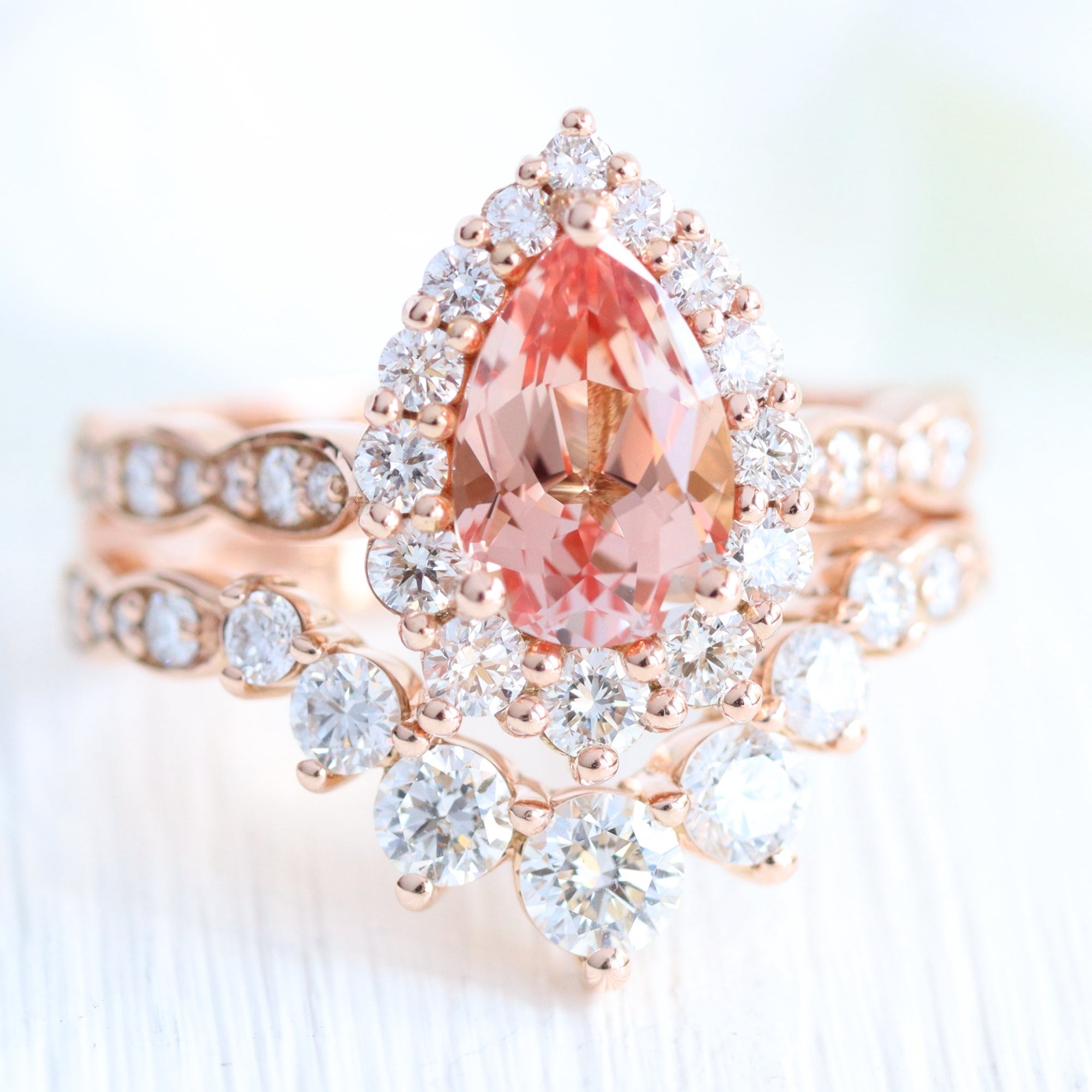 Large pear peach sapphire ring stack rose gold curved diamond wedding band la more design jewelry