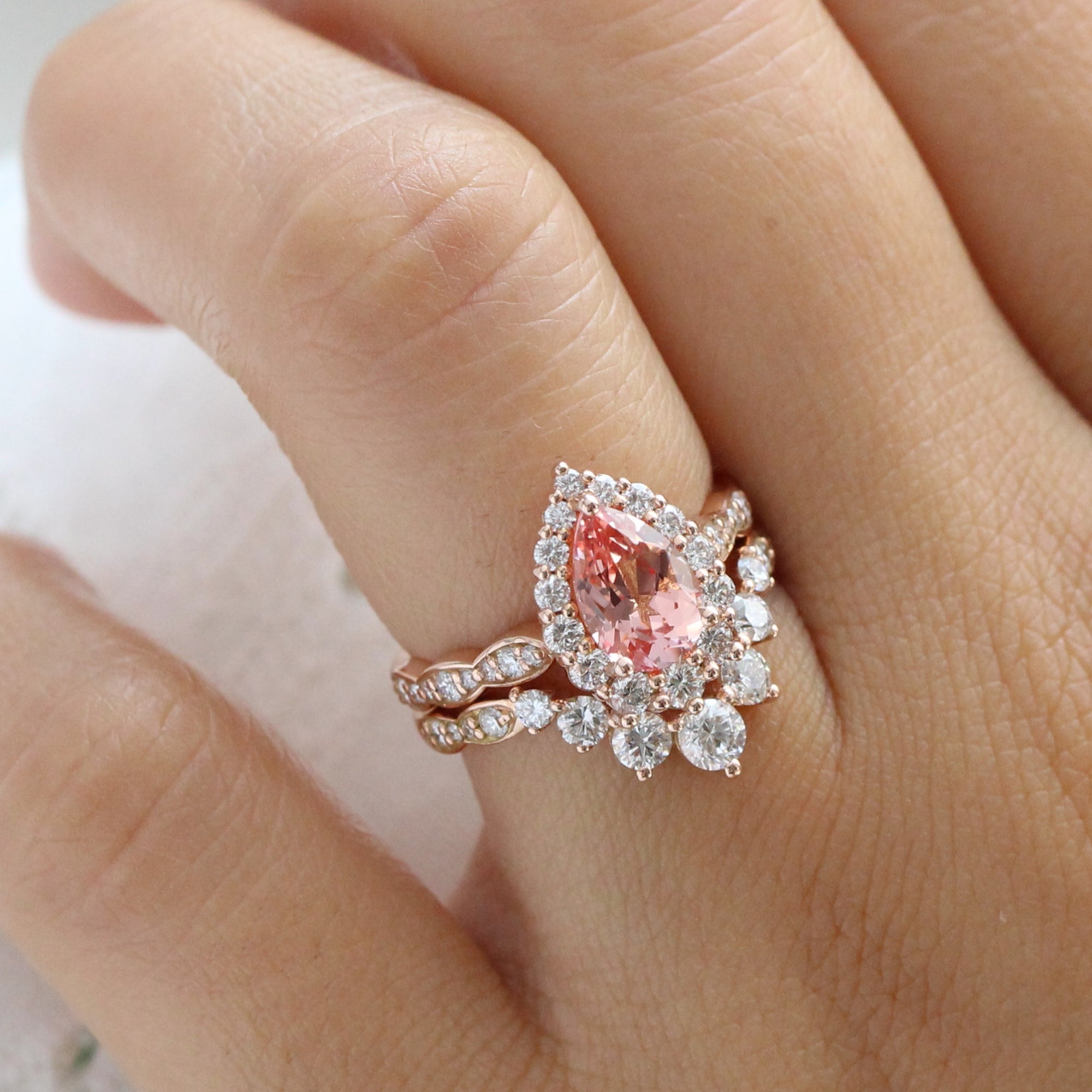 Large pear peach sapphire ring stack rose gold curved diamond wedding band la more design jewelry