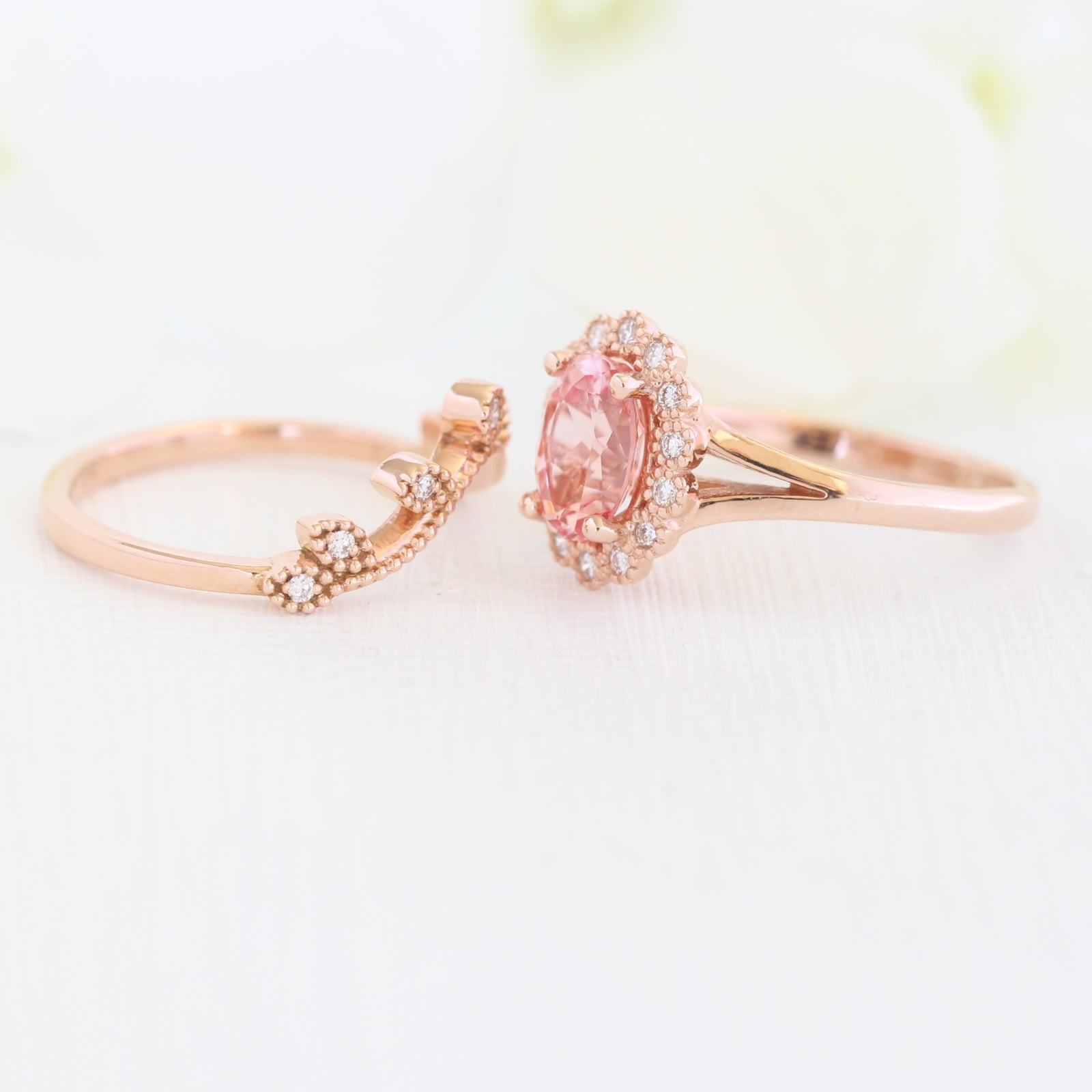 oval peach sapphire ring and curved diamond band in rose gold bridal set by la more design