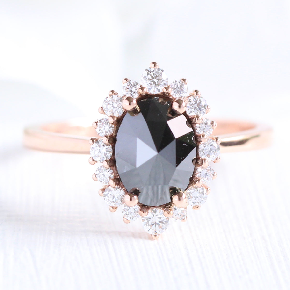 Oval rose cut black diamond engagement ring in rose gold halo diamond band by la more design jewelry