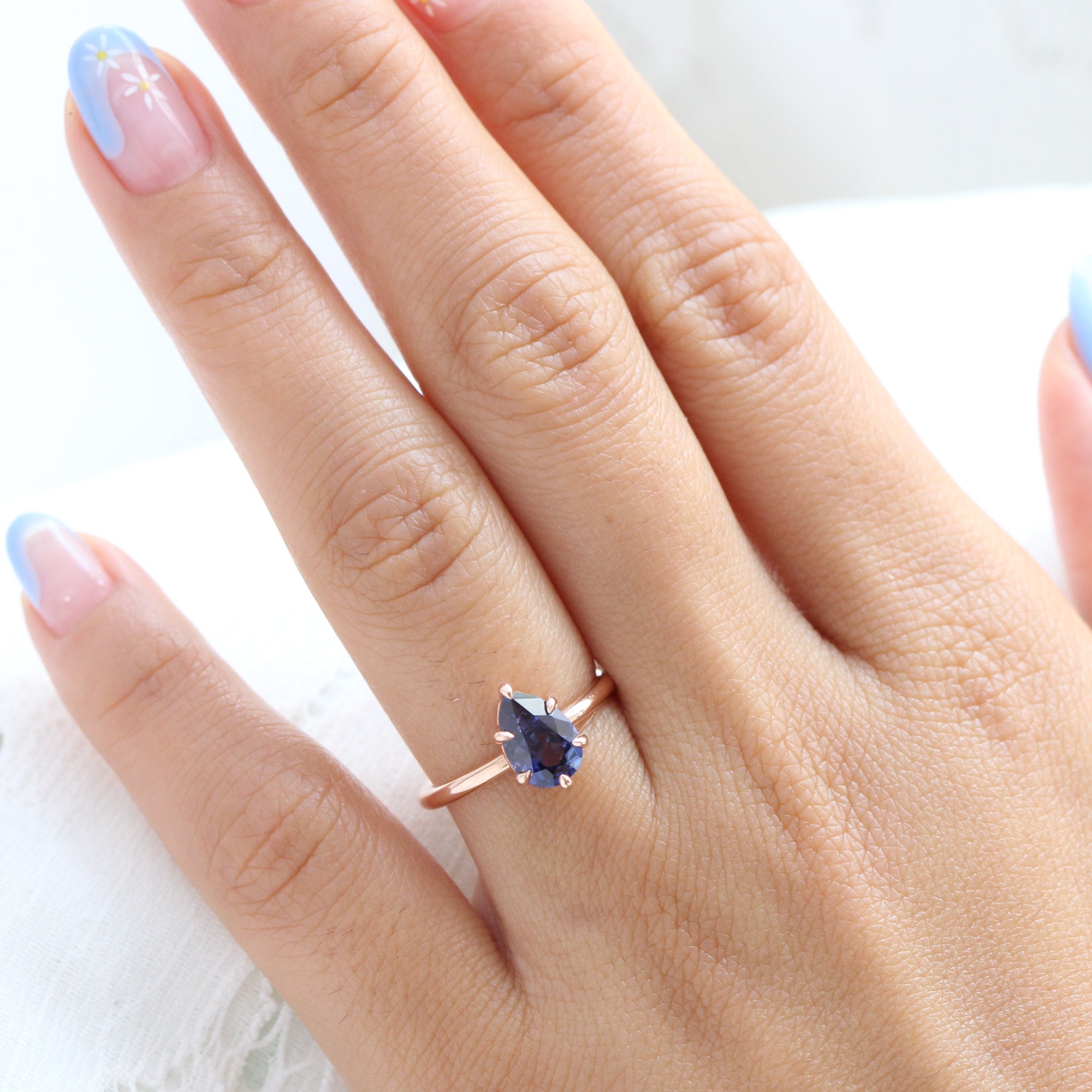 Pear cut purple blue sapphire ring rose gold low setting solitaire engagement ring la more design jewelry