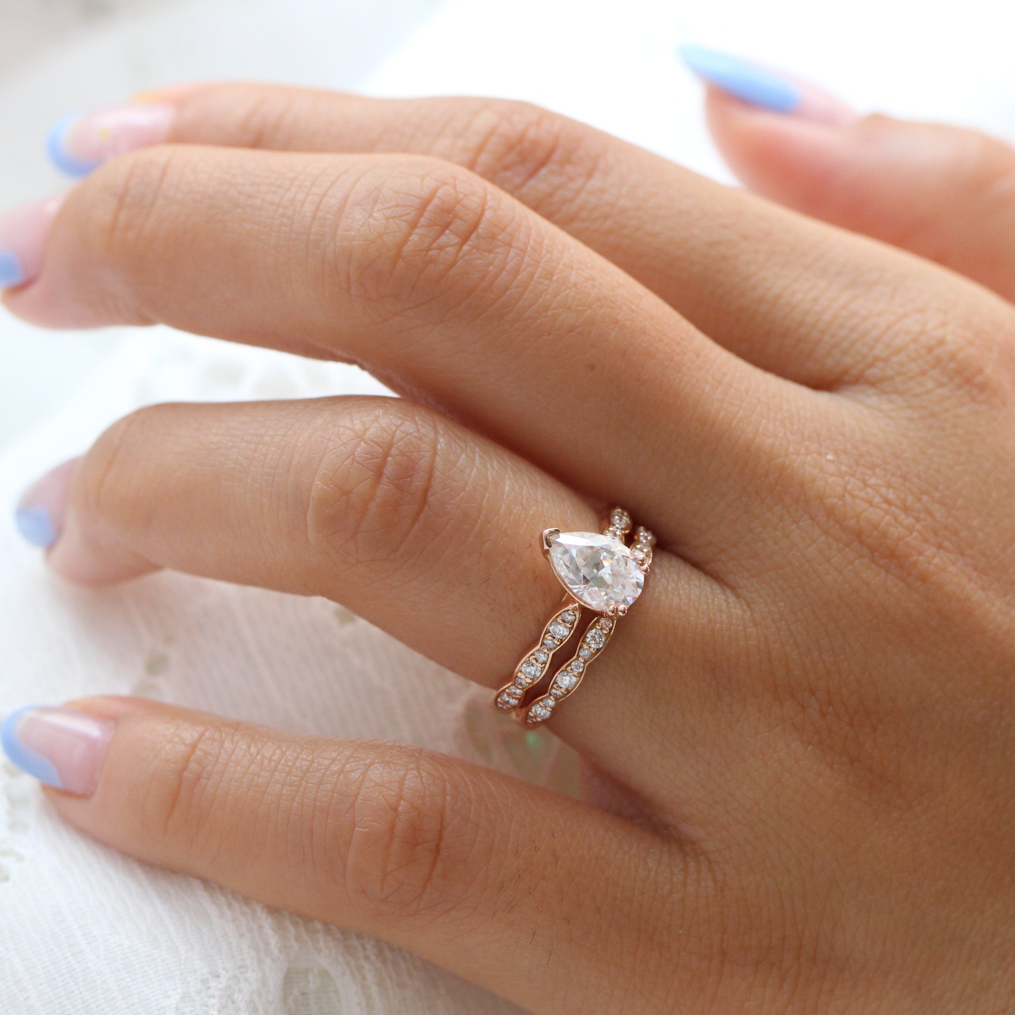 Pear moissanite diamond solitaire ring rose gold matching diamond wedding band la more design jewelry