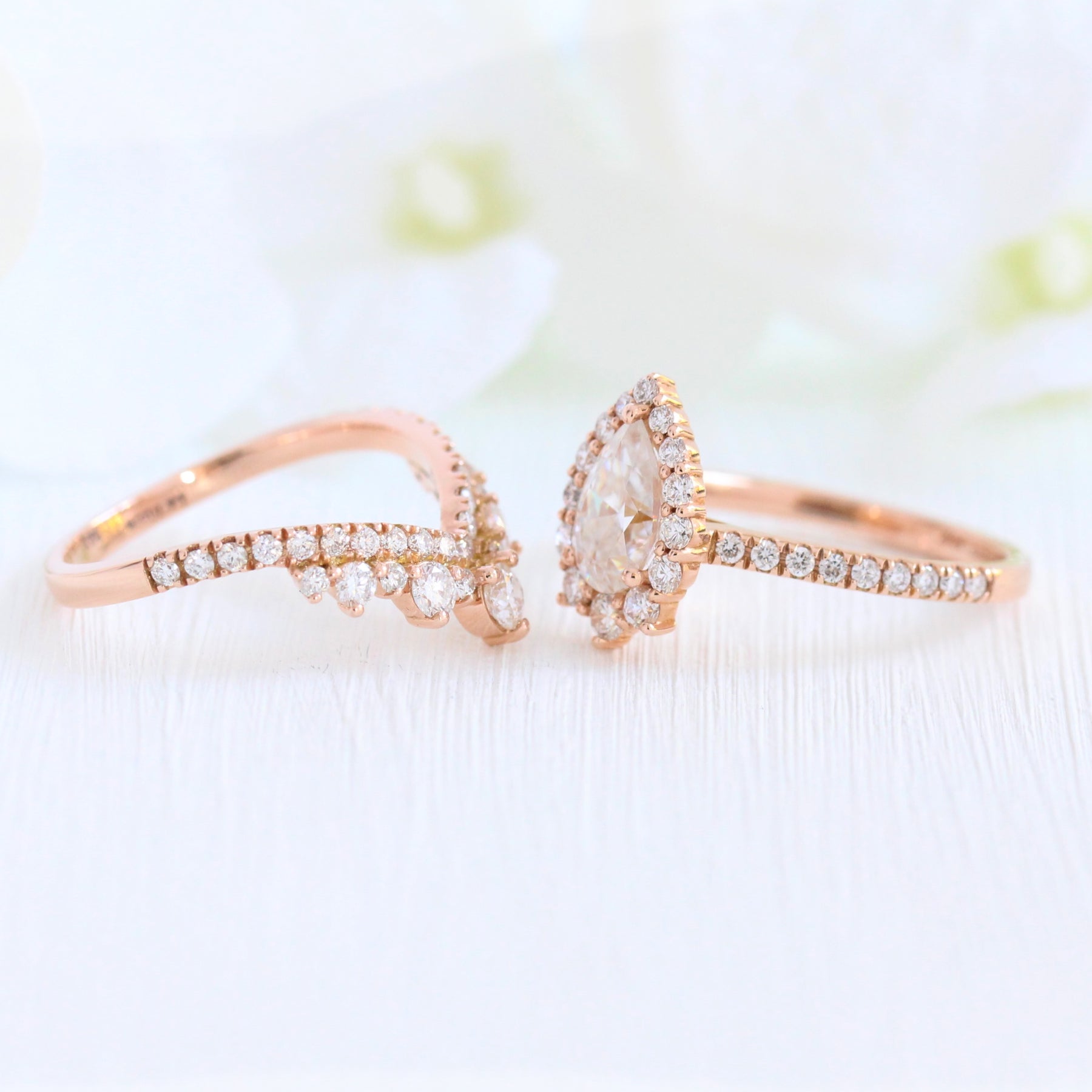 Pear moissanite engagement ring rose gold halo diamond bridal set and contour diamond wedding band by la more design jewelry