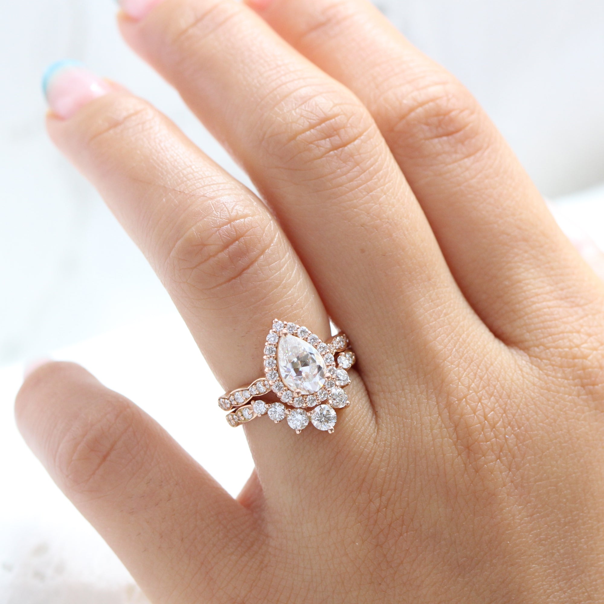 Pear moissanite ring rose gold large 7 diamond u shaped wedding band stacking rings la more design jewelry