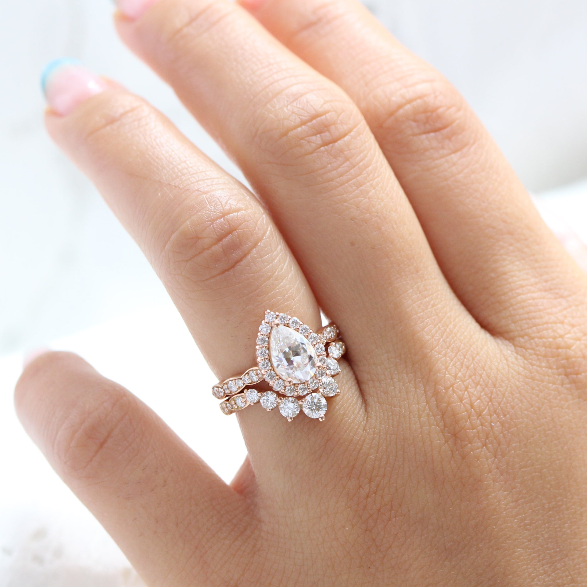 Pear moissanite ring rose gold large 7 diamond u shaped wedding band stacking rings la more design jewelryPear moissanite ring rose gold large 7 diamond u shaped wedding band stacking rings la more design jewelry