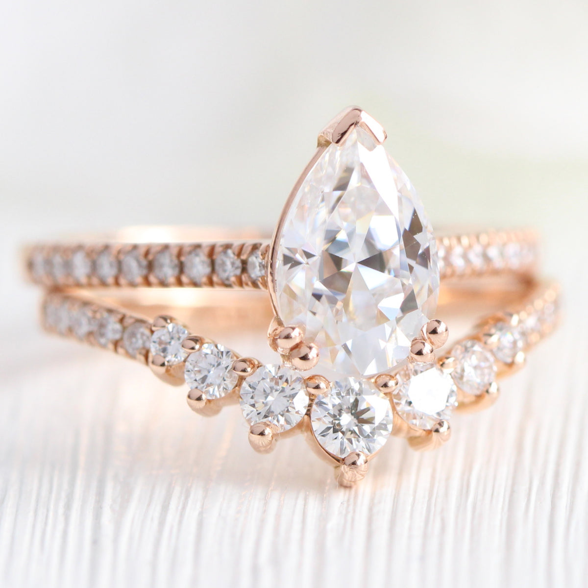 Pear moissanite solitaire ring rose gold curved diamond wedding ring set la more design jewelry