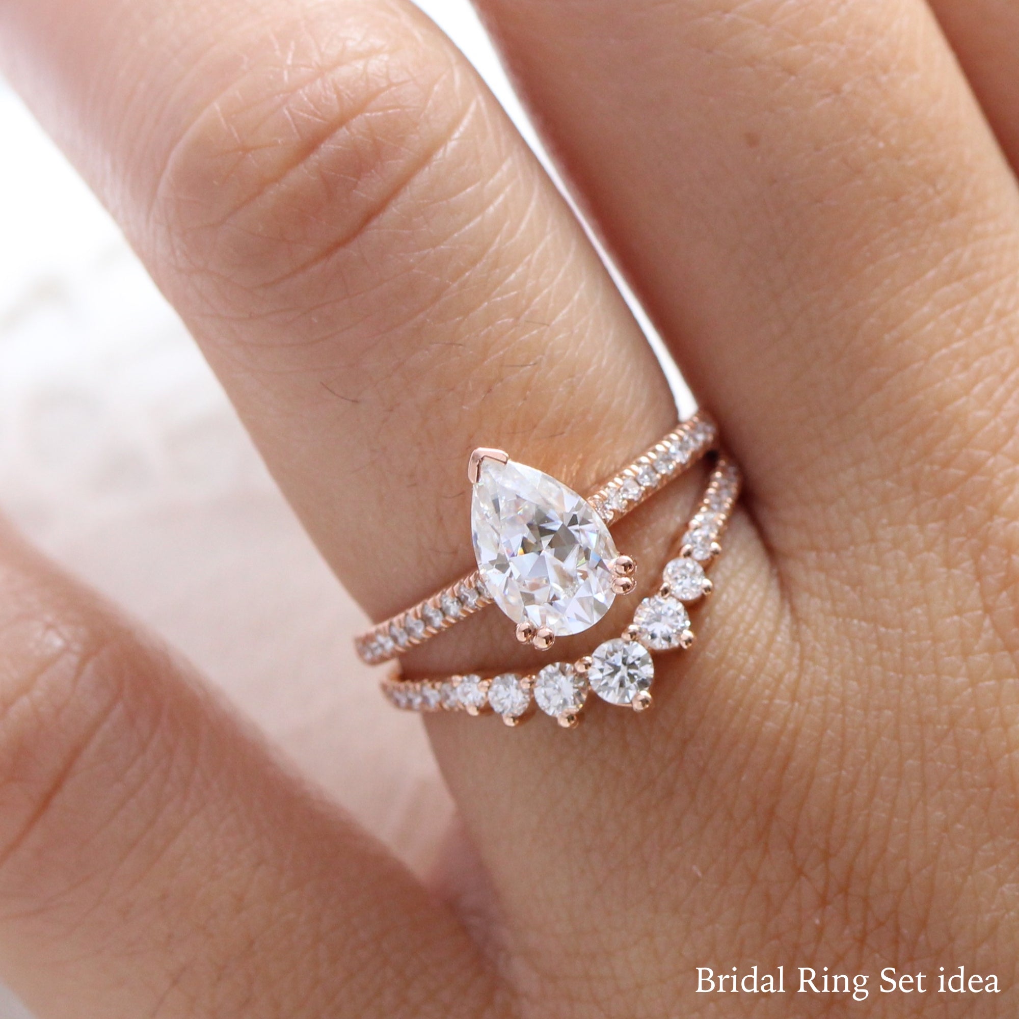 Pear moissanite solitaire ring rose gold curved diamond wedding ring set la more design jewelry