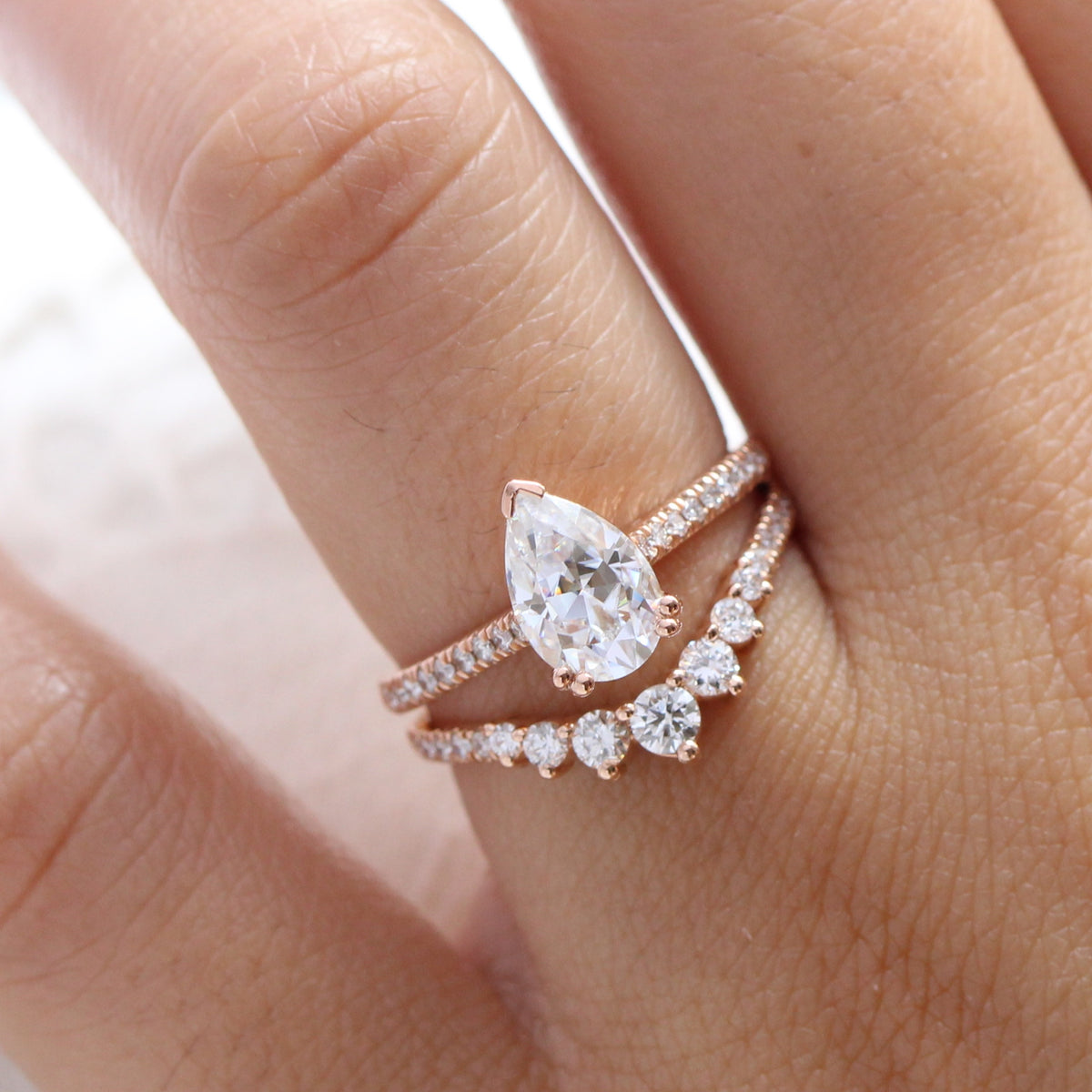 Pear moissanite solitaire ring rose gold curved diamond wedding ring set la more design jewelry