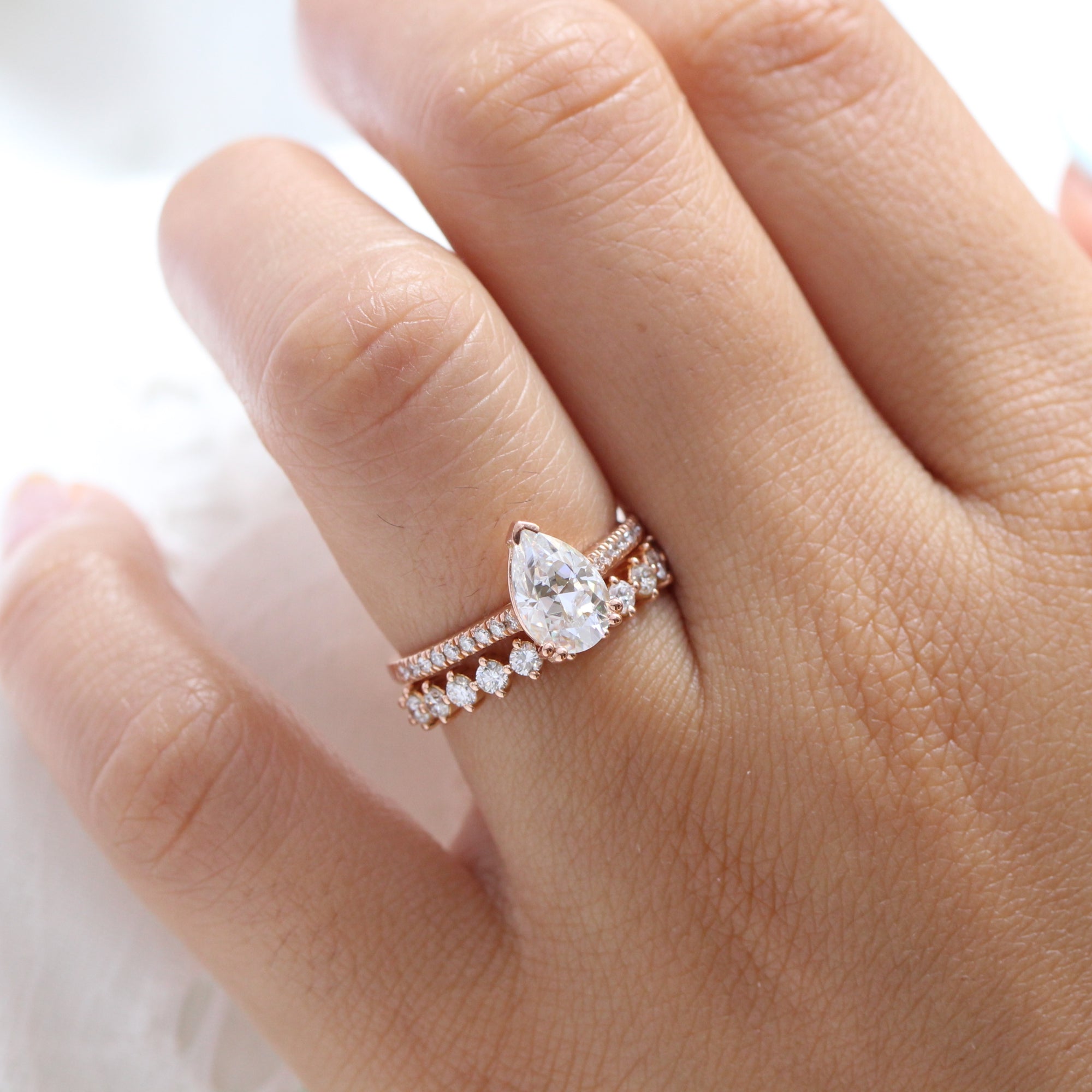 Pear moissanite solitaire ring rose gold matching diamond wedding ring set la more design jewelry