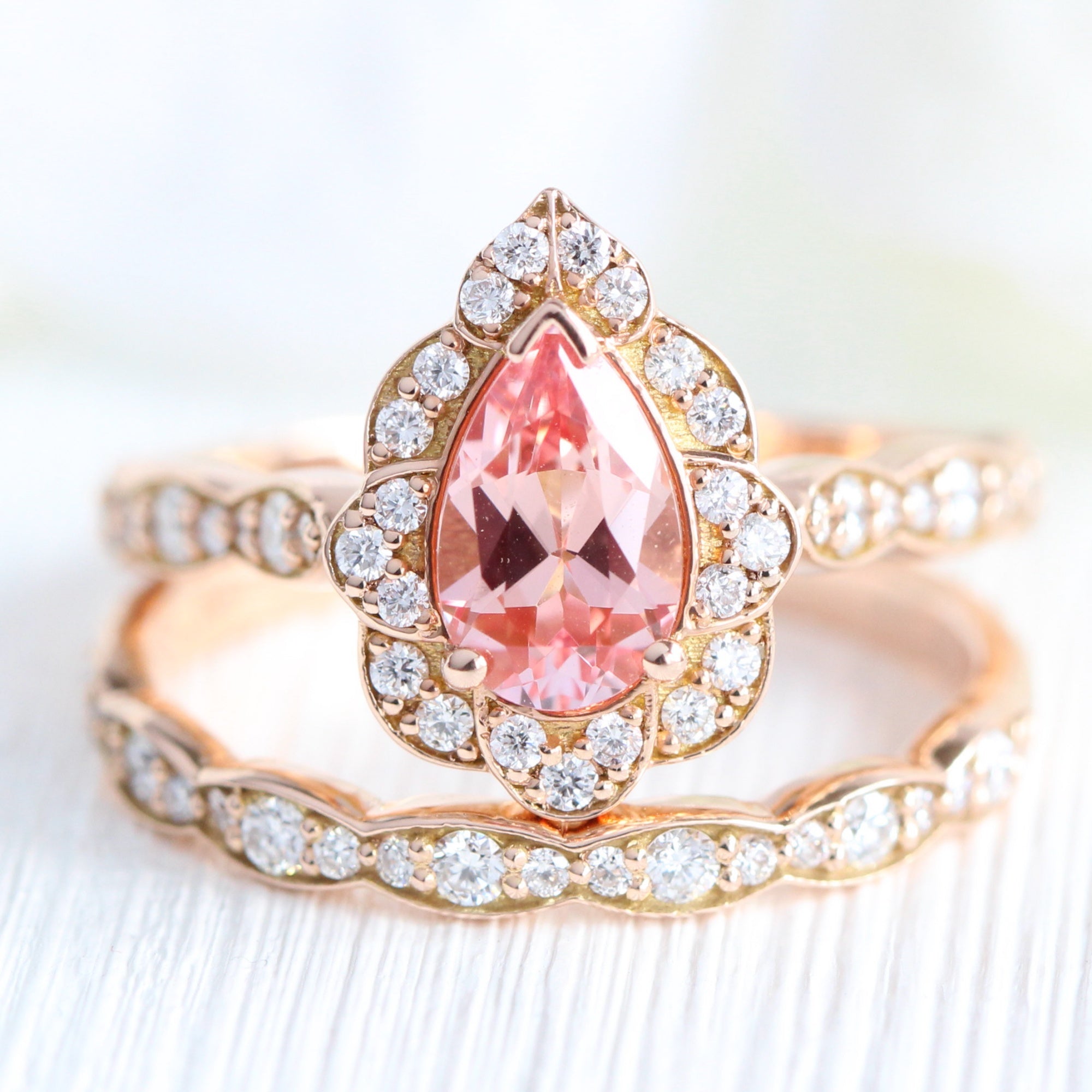 Pear peach sapphire engagement ring rose gold vintage halo diamond ring stack by la more design jewelry