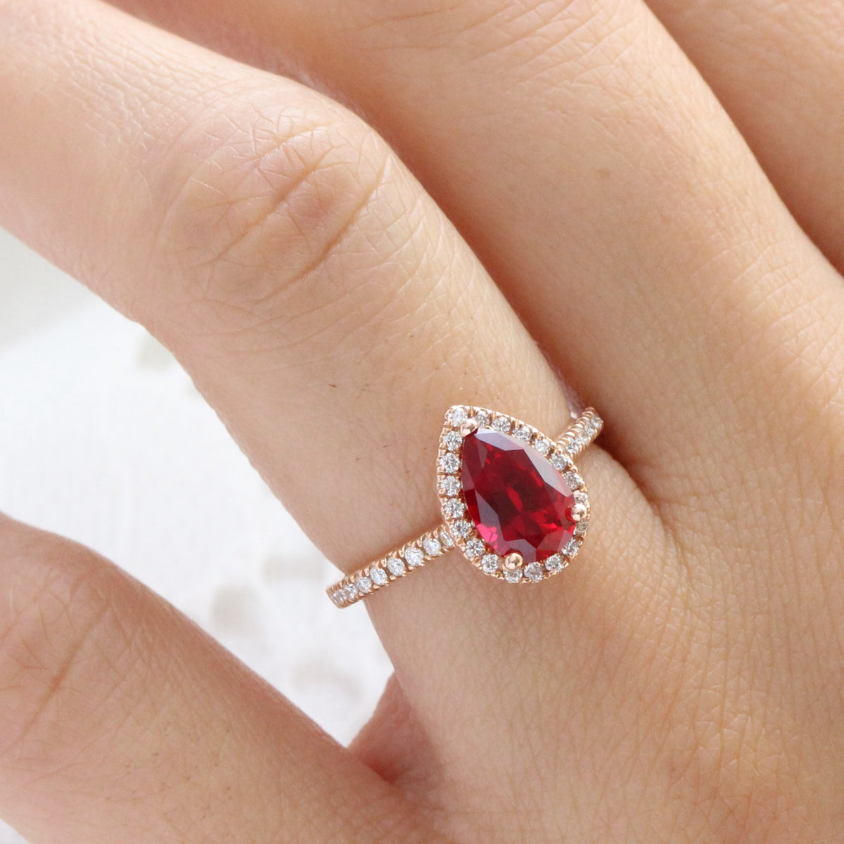 Pear ruby engagement ring rose gold halo diamond ruby ring la more design jewelry