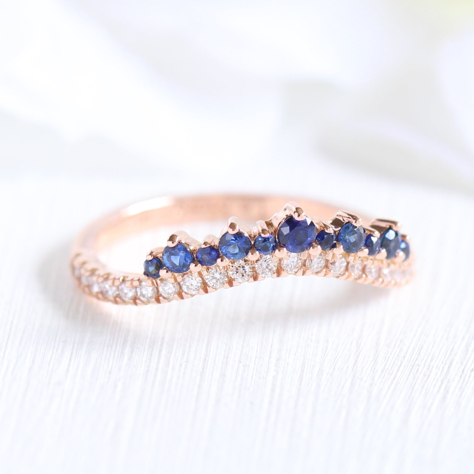 Sapphire and diamond curved wedding ring in rose gold crown band by la more design