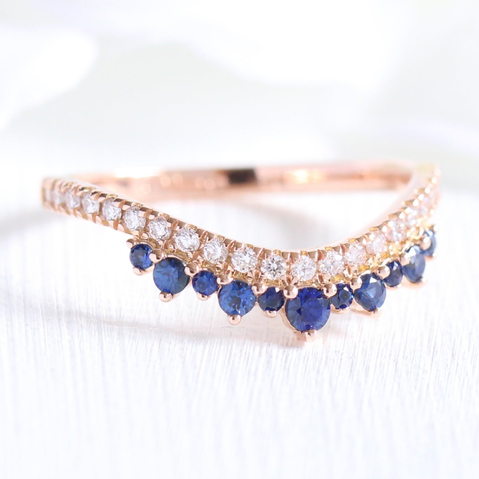 Sapphire and diamond curved wedding ring in rose gold crown band by la more design jewelry
