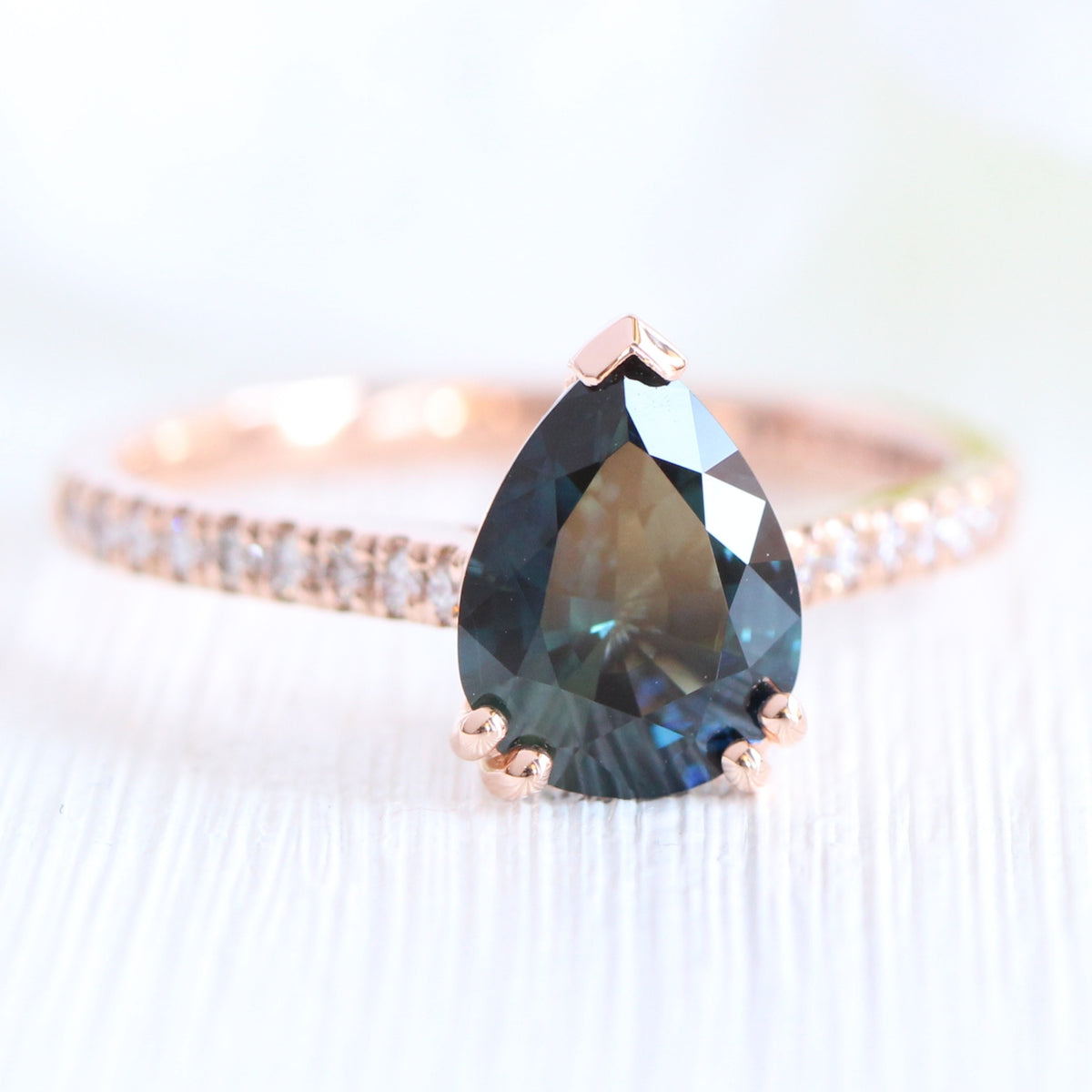 Solitaire pear teal green sapphire ring rose gold pave diamond band la more design jewelry