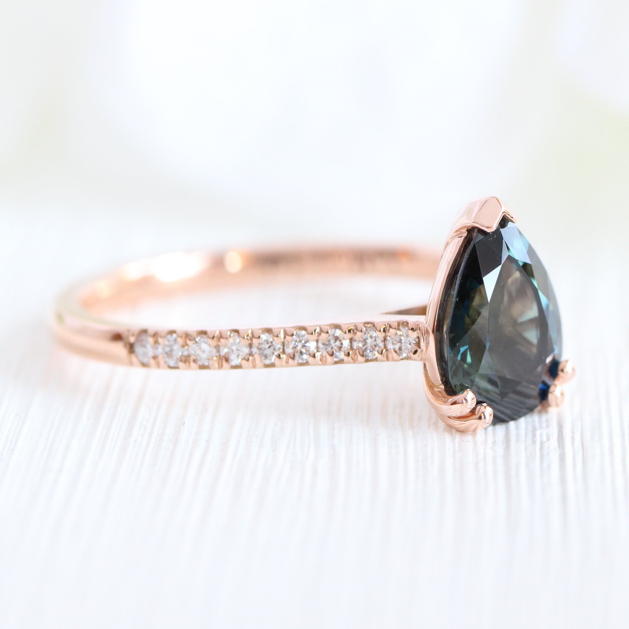 Solitaire pear teal green sapphire ring rose gold pave diamond band la more design jewelry