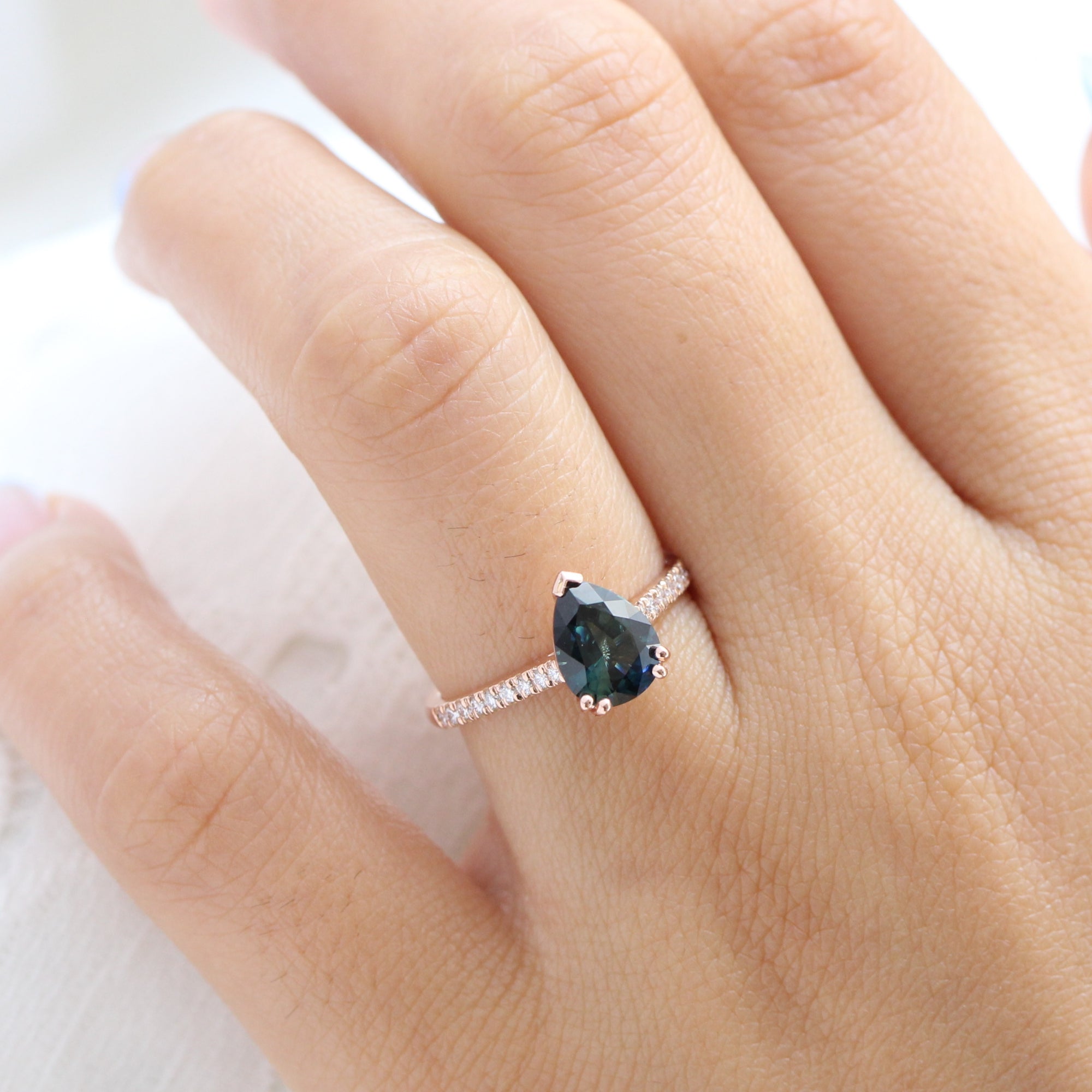 Solitaire pear teal green sapphire ring rose gold pave diamond band la more design jewelry