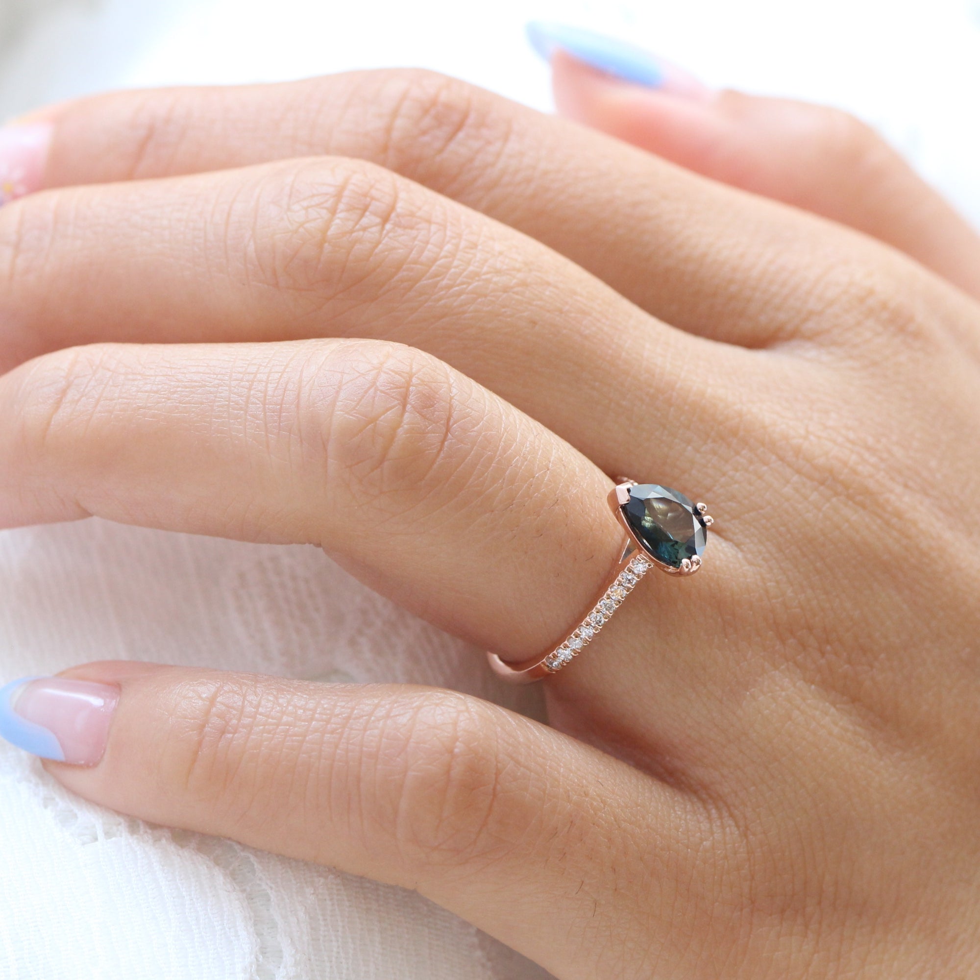 Solitaire pear teal green sapphire ring rose gold pave diamond band la more design jewelry