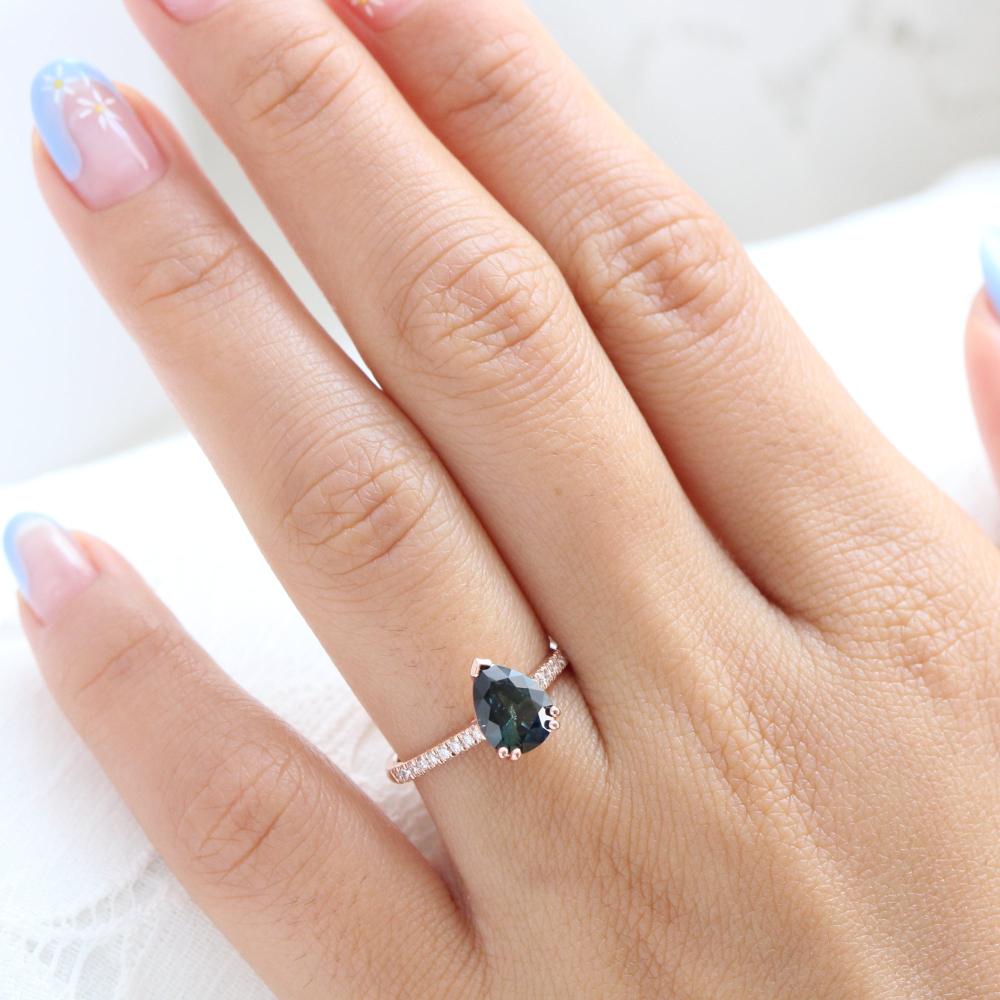 Solitaire pear teal green sapphire ring rose gold pave diamond band la more design jewelry