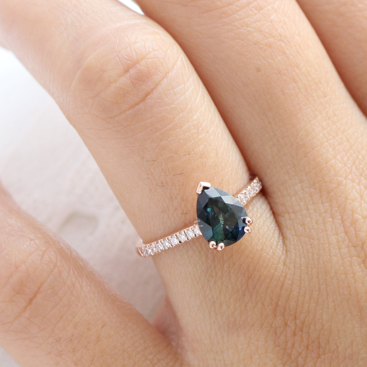 Solitaire pear teal green sapphire ring rose gold pave diamond band la more design jewelry