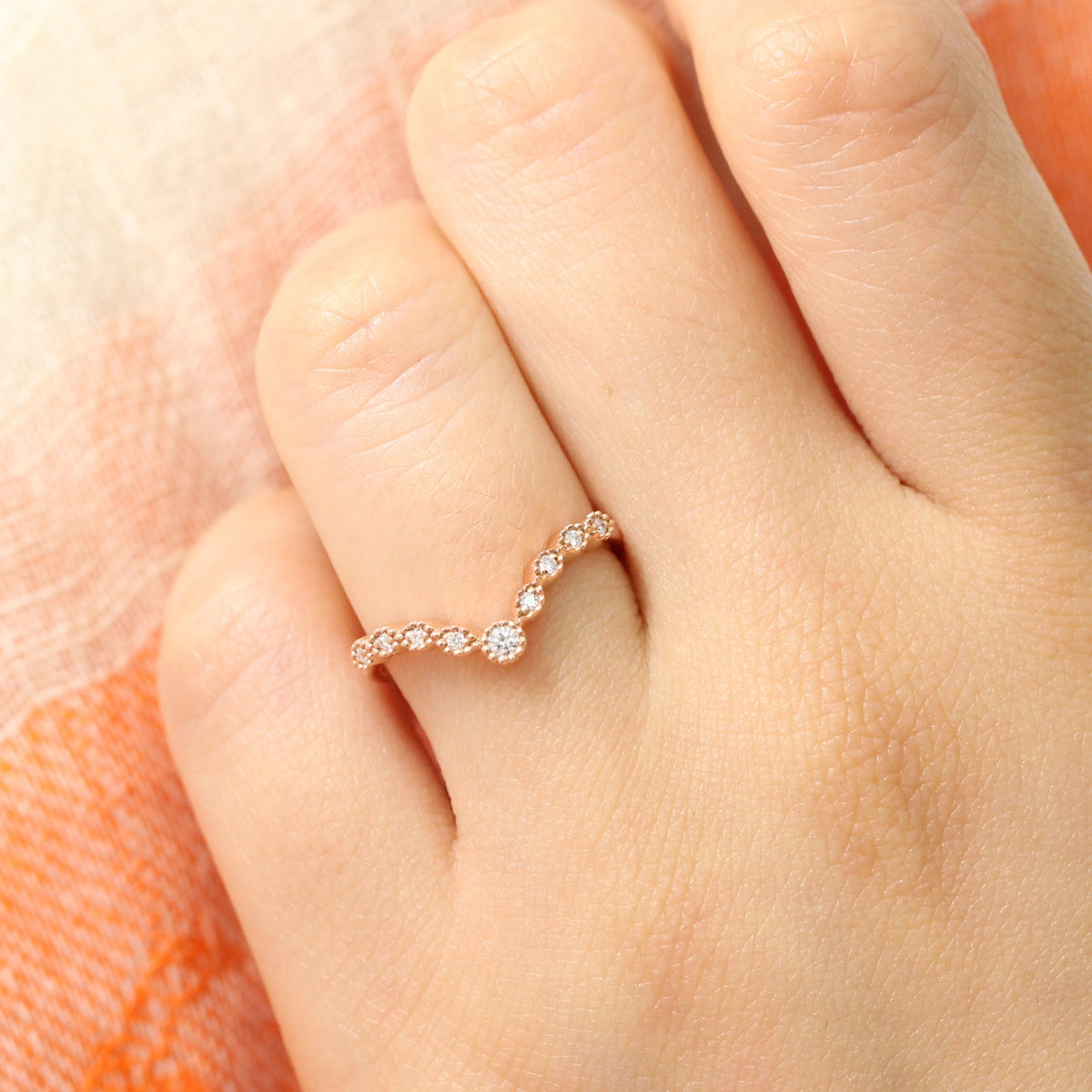 V shaped diamond ring in rose gold curved wedding band by la more design