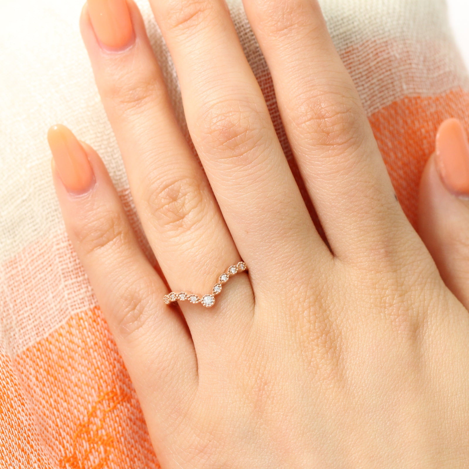 V shaped diamond ring in rose gold curved wedding band by la more design