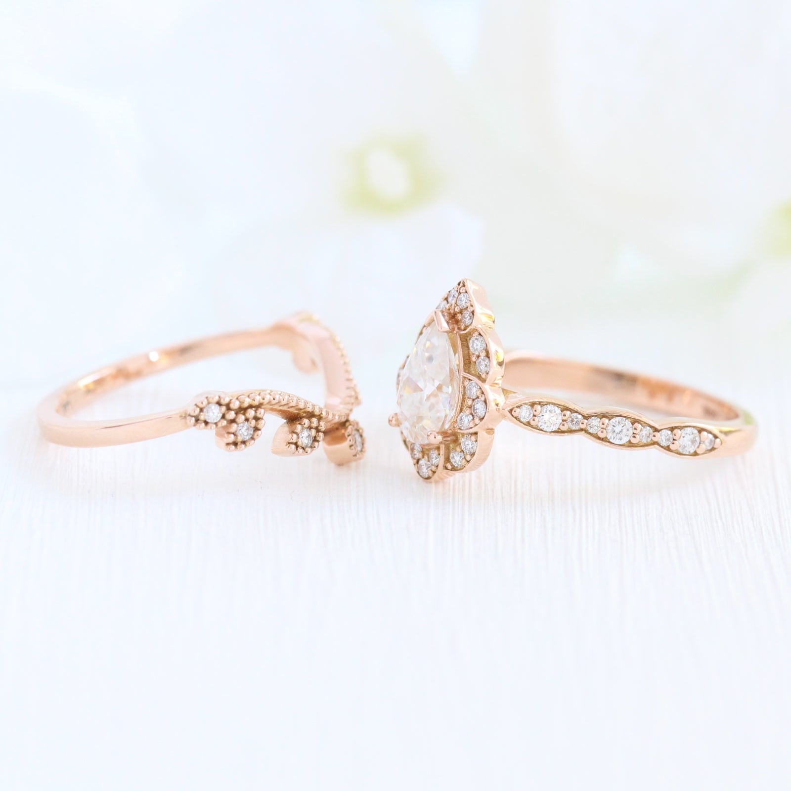 Vintage floral pear moissanite ring bridal set and curved leaf diamond wedding band rose gold by la more design jewelry