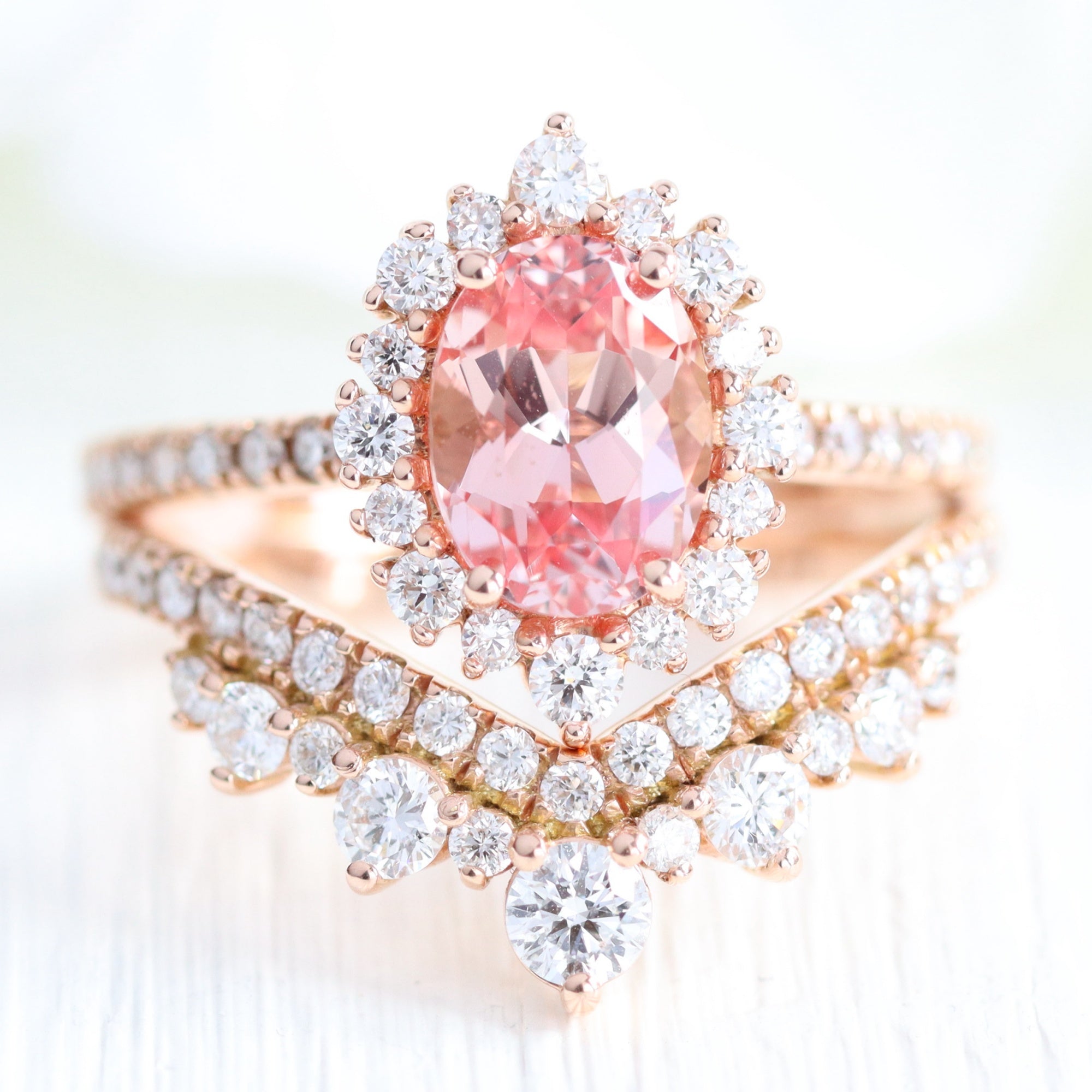 Vintage halo oval peach sapphire ring stack rose gold v shaped diamond wedding band la more design jewelry