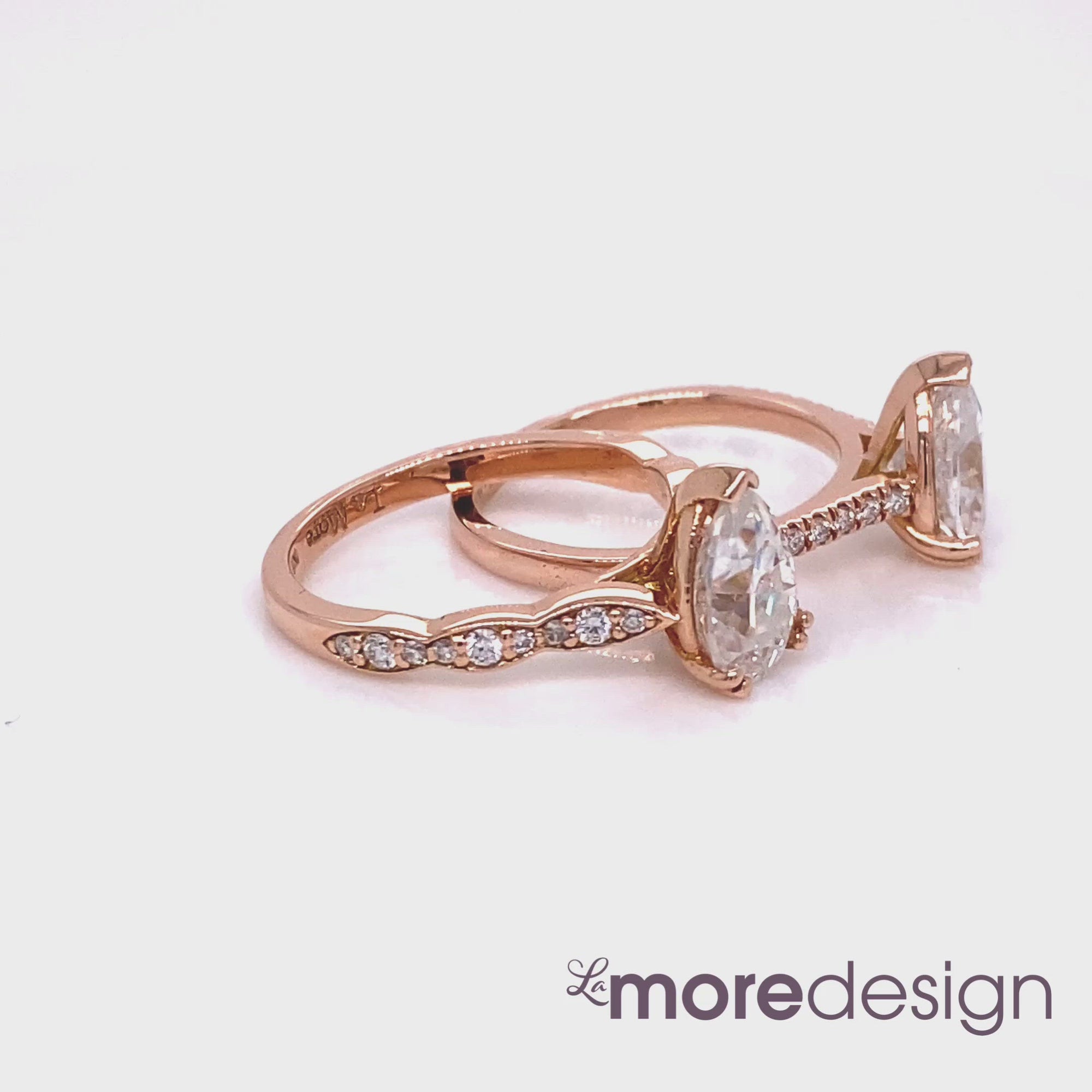 Solitaire pear moissanite engagement ring in rose gold scalloped diamond and pave diamond band by la more design